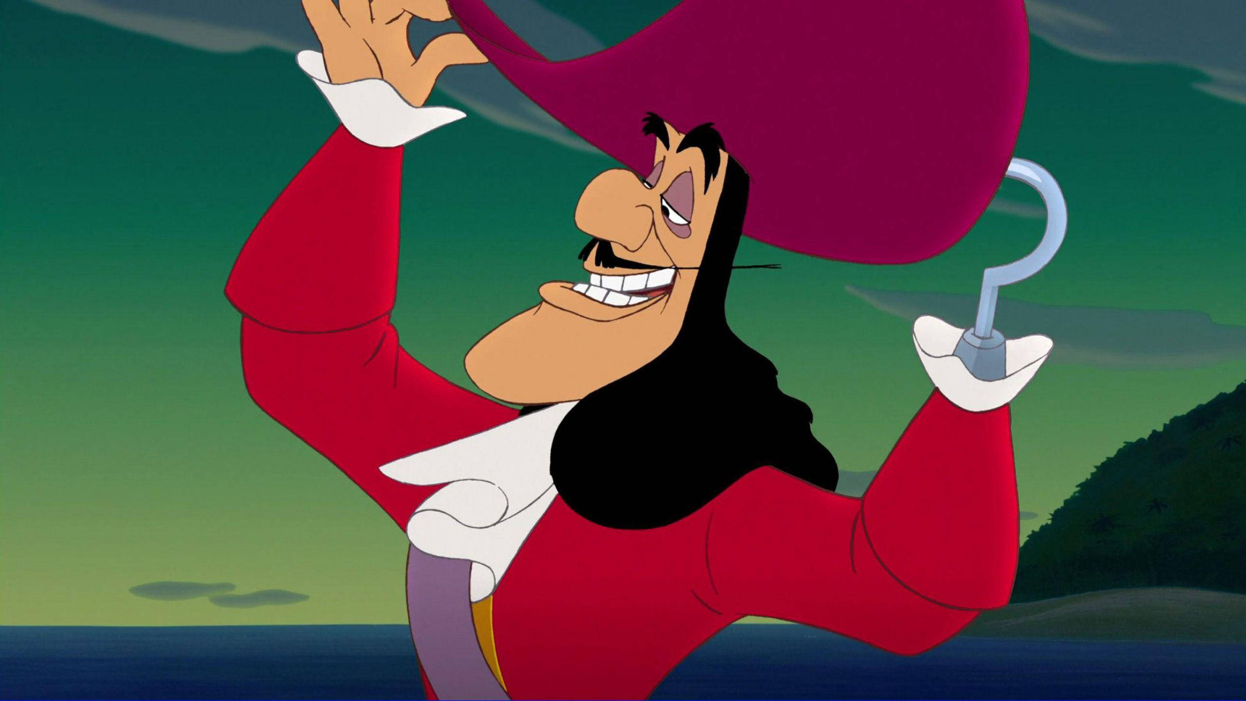 Hook 桌布 壁紙 — 一個卡通海盜，手戴鉤子，身穿紅色外套，在綠色海洋背景下勝利地大笑。