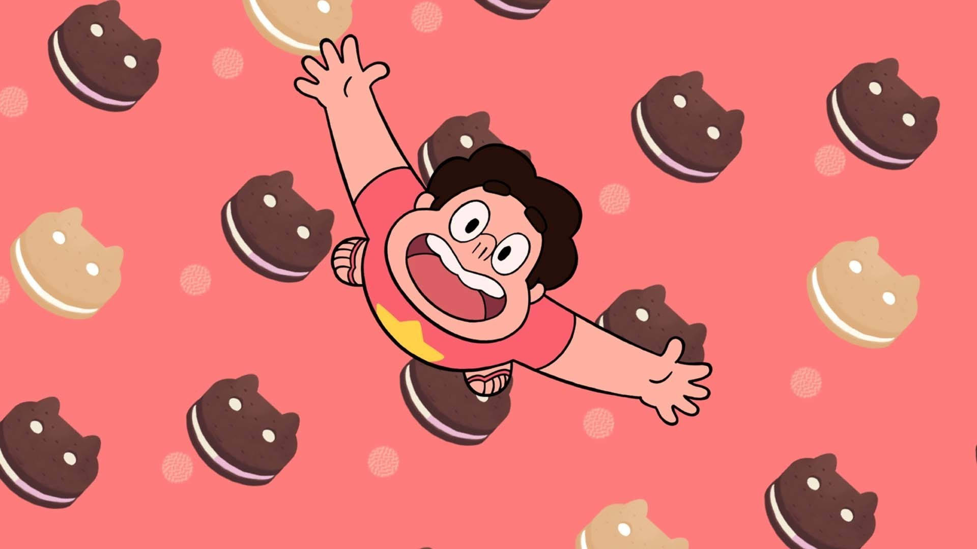 Cartoon Network 桌布 壁紙 — 一個卡通男孩在粉紅色背景中，快樂地漂浮在落下的貓形餅乾之間。