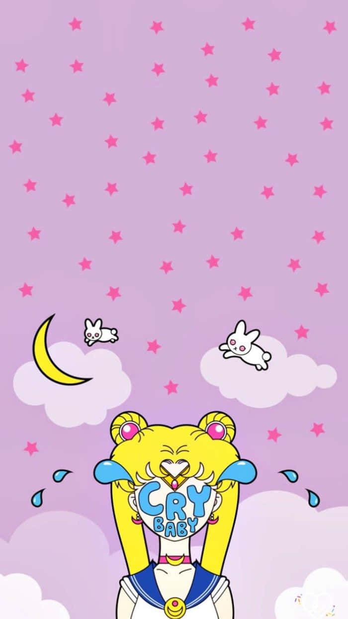 Sailor Moon Pattern 桌布 壁紙 — 一個卡通美少女戰士角色在粉紅色星空下，抱著一個寫著「cry baby」的牌子哭泣，背景有漂浮的兔子和新月。