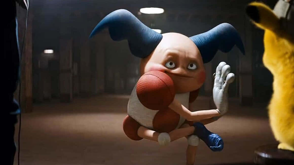 Mr. Mime 桌布 壁紙 — 一個卡通藍色角角色在昏暗的體育館中，緊張地抓住一個籃球。