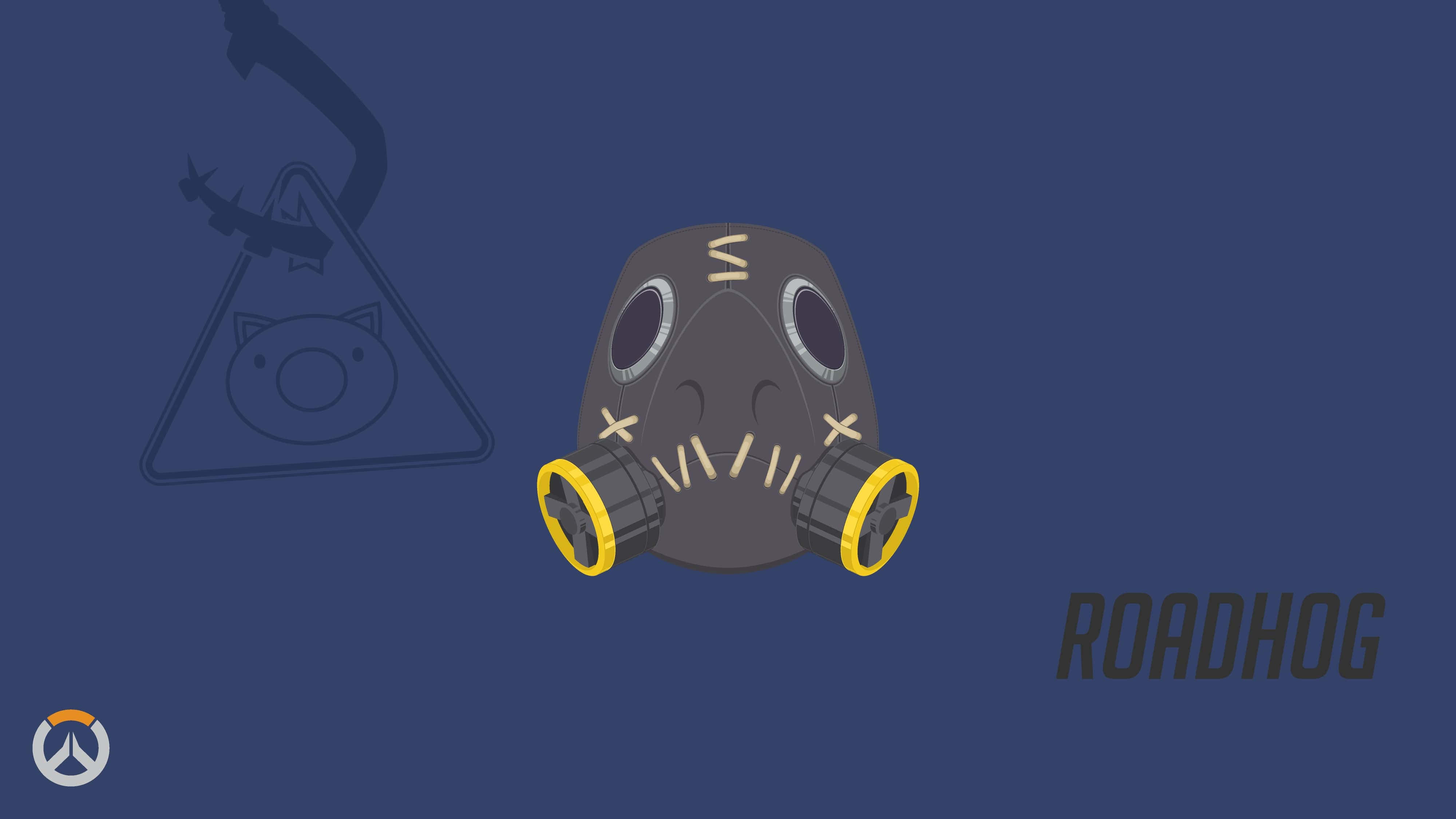 Overwatch Roadhog 桌布 壁紙 — 一個卡通風格的灰色防毒面具，帶有黃色濾芯和縫合的口部，居中放置在帶有微弱Overwatch標誌元素的深藍色背景上。