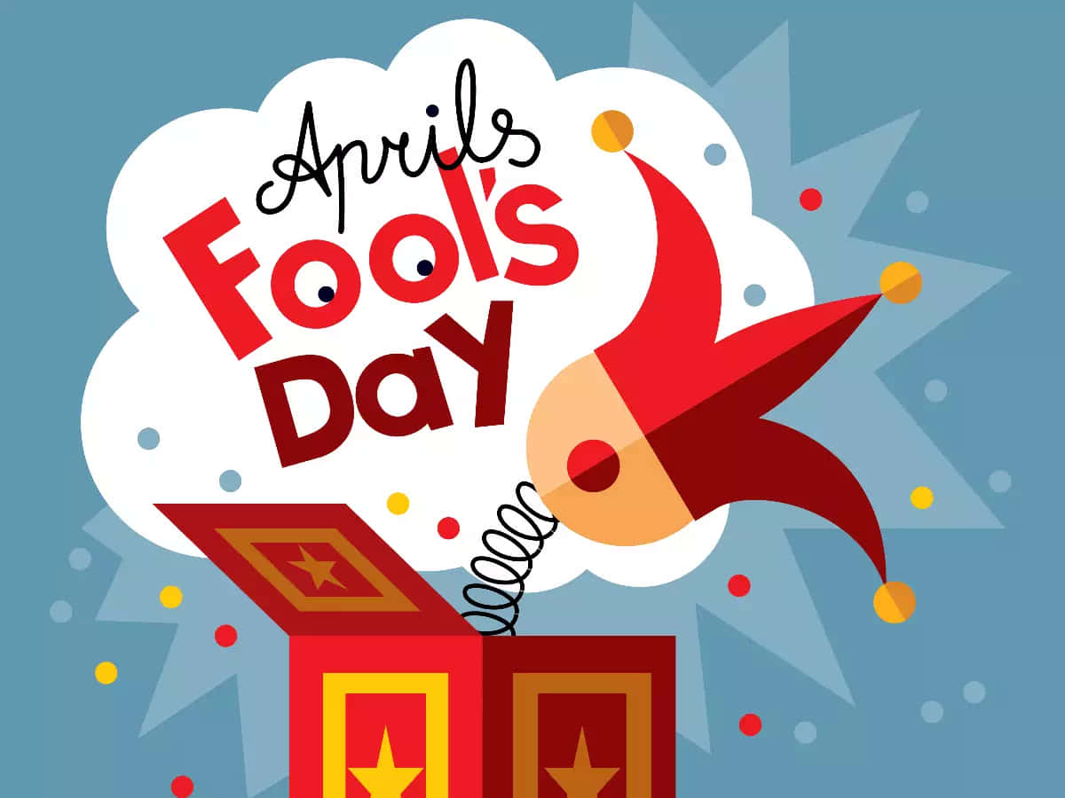 April Fools 桌布 壁紙 — 一個卡通驚喜盒彈開，露出小丑帽和「April Fool's Day」文字，呈現有趣的爆炸效果。