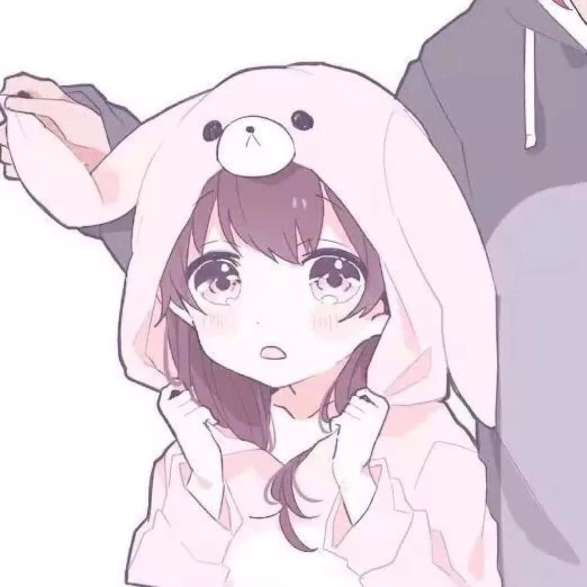 可愛動漫頭貼 桌布 壁紙 — 一個可愛的動漫女孩穿著粉紅色兔子連帽衫，睜大眼睛、臉頰泛紅，看起來很驚訝。
