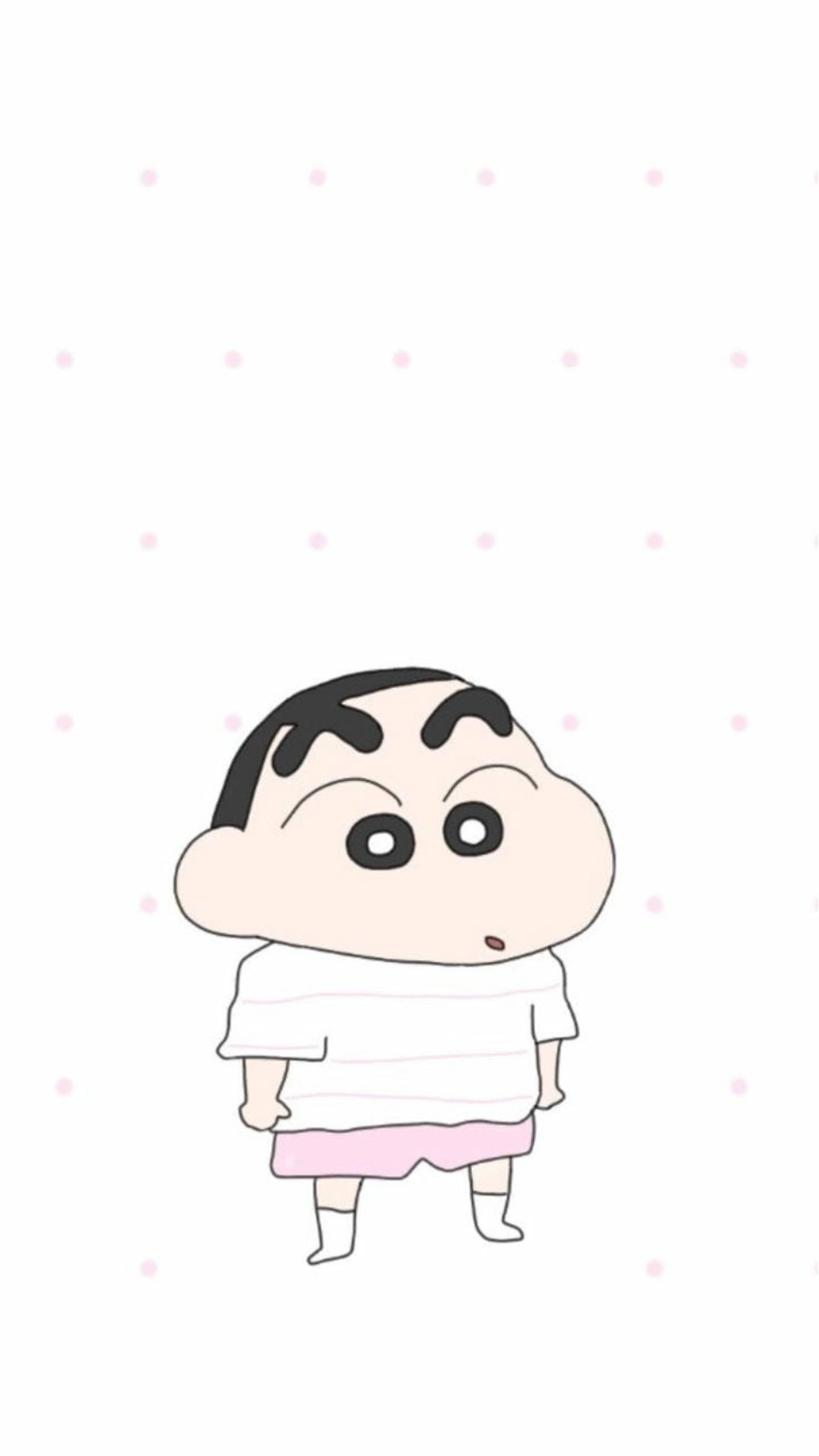 shinchan 桌布 壁紙 — 一個可愛的卡通男孩，大眼睛和尖刺頭髮，站在帶有粉紅色圓點的白色背景前。