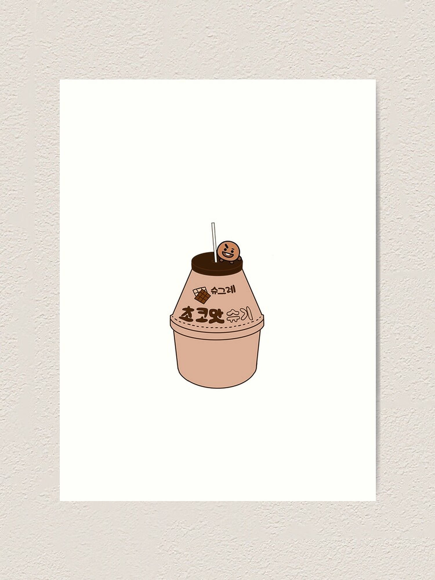 shooky bt21 桌布 壁紙 — 一個可愛的卡通風格巧克力奶昔杯，帶有笑臉蓋子和韓文文字，背景為白色。