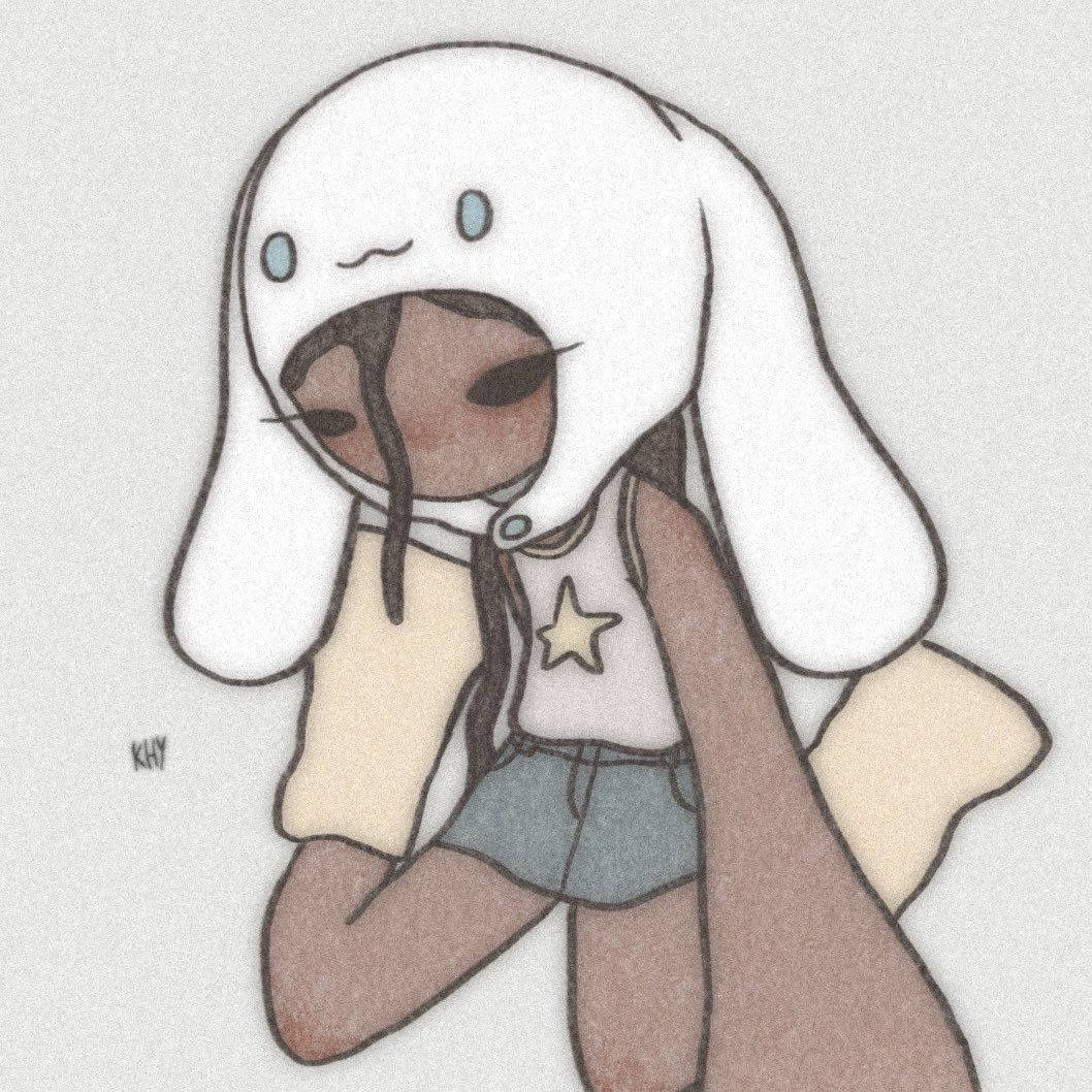 少女風 桌布 壁紙 — 一個可愛的深色皮膚卡通女孩，穿著白色兔子連帽衫和星星上衣，交叉手臂坐著。