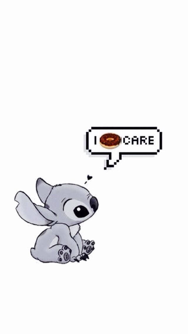I Dont Care 桌布 壁紙 — 一個可愛的灰色卡通外星人坐著，旁邊有一個像素對話框，顯示一個甜甜圈和文字「我❤️關懷」。