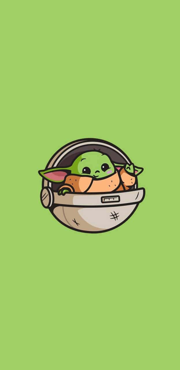 Cartoon Yoda 桌布 壁紙 — 一個可愛的綠色 Baby Yoda 戴著頭盔，從淺綠色背景中探出頭來。
