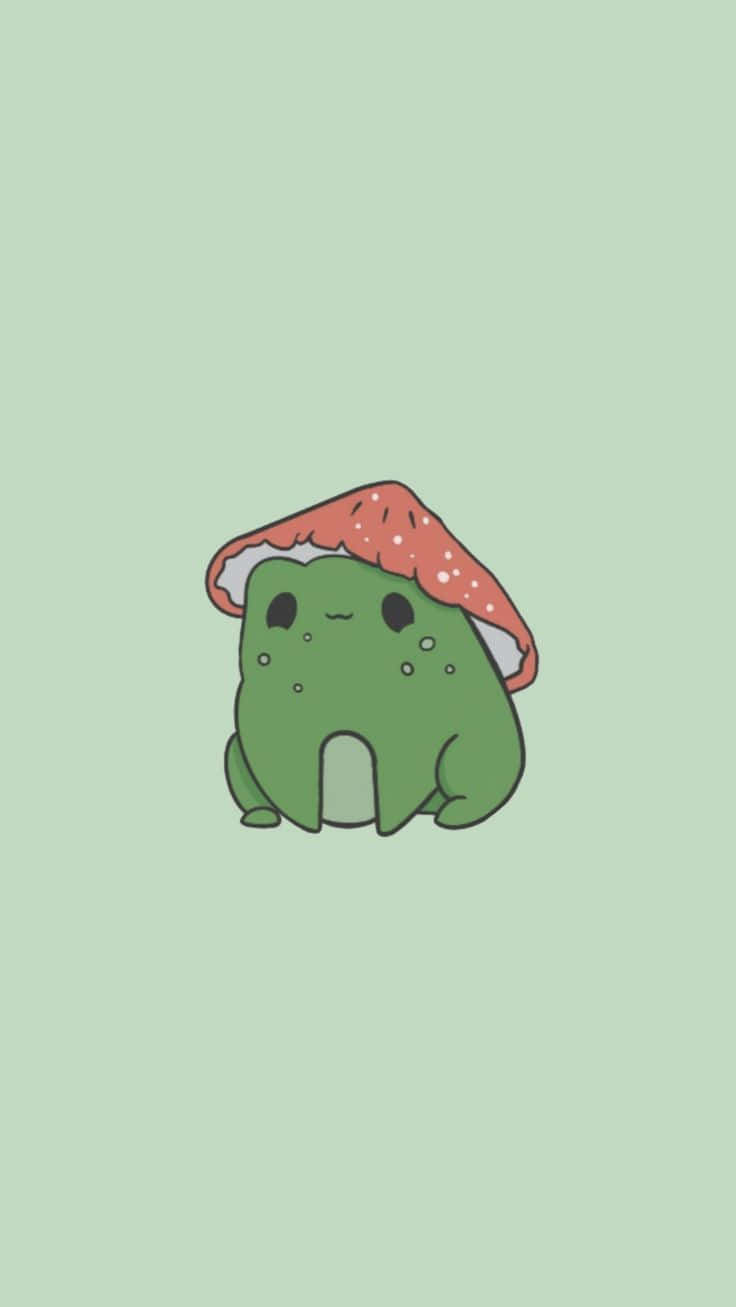搞笑 桌布 壁紙 — 一個可愛的綠色卡通生物，戴著紅色斑點蘑菇帽，平靜地坐在淺綠色背景上。