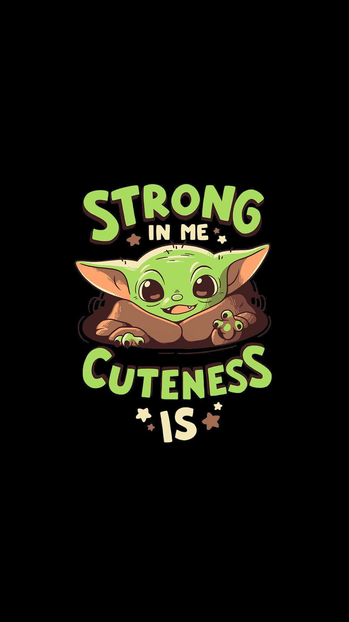 Baby Yoda Cartoon 桌布 壁紙 — 一個可愛的綠色寶寶尤達角色，大眼睛微笑，黑色背景上寫著「STRONG IN ME CUTENESS IS」。