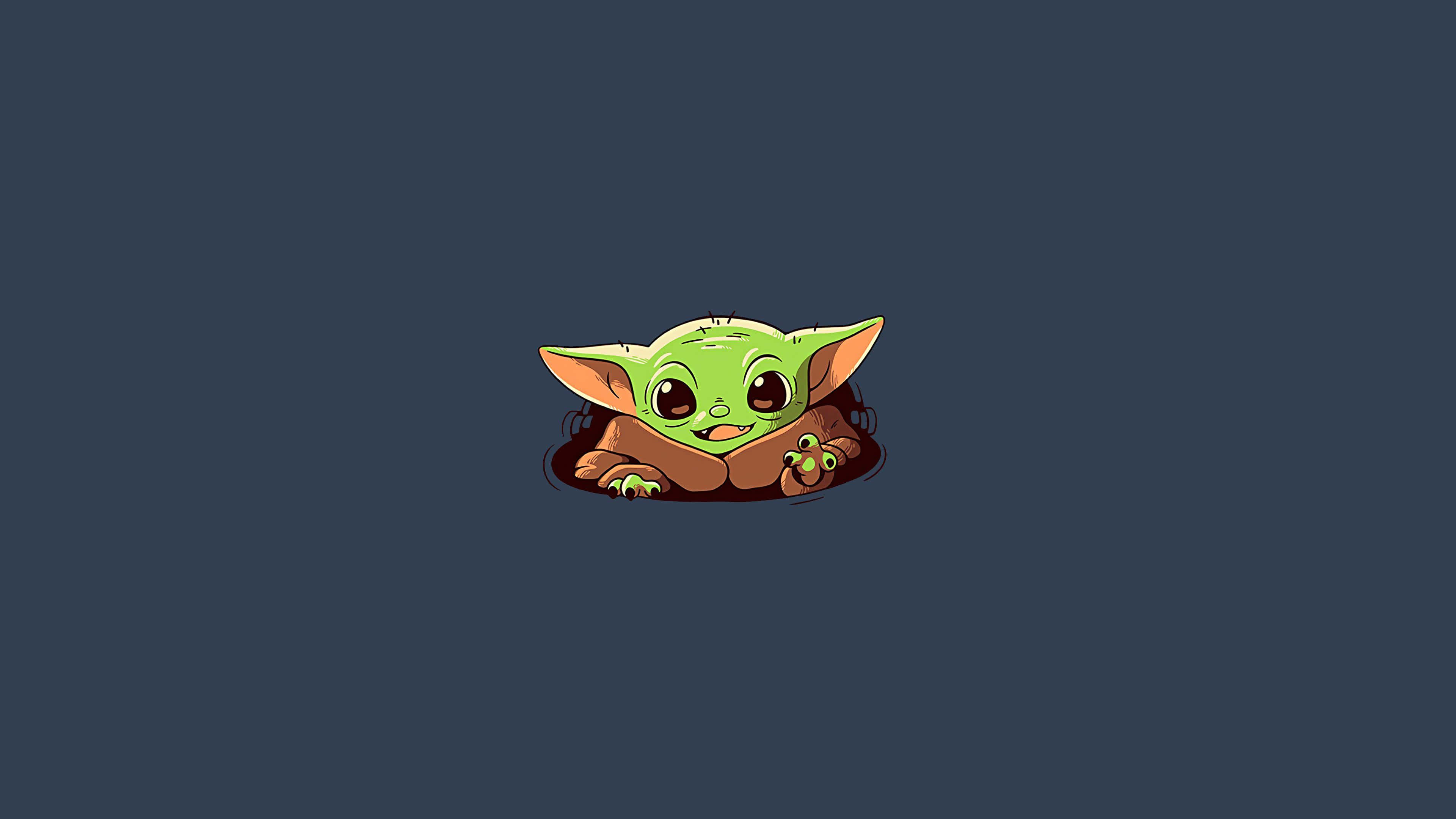 Baby Yoda Cartoon 桌布 壁紙 — 一個可愛的綠色小尤達從棕色毯子裡探出頭來，背景是深藍色。
