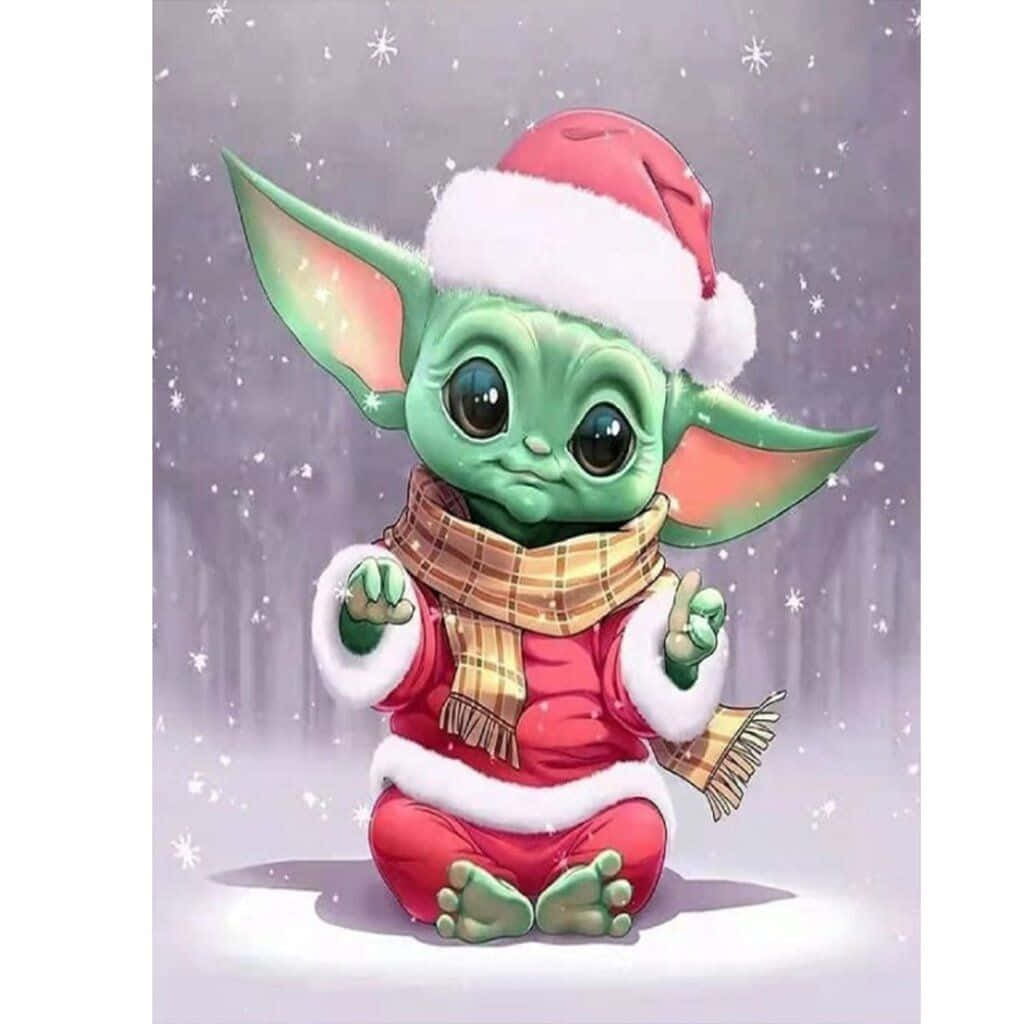 Baby Yoda Christmas 桌布 壁紙 — 一個可愛的綠色尤達寶寶，穿著紅色聖誕老人套裝和格子圍巾，坐在飄落的雪中，眼睛閃閃發光。