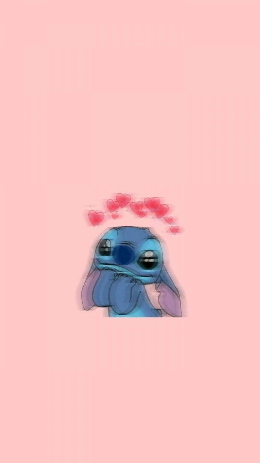 Vintage Cartoon Aesthetic 桌布 壁紙 — 一個可愛的藍色外星人角色，頭頂漂浮著心形圖案，背景是柔和的粉紅色。