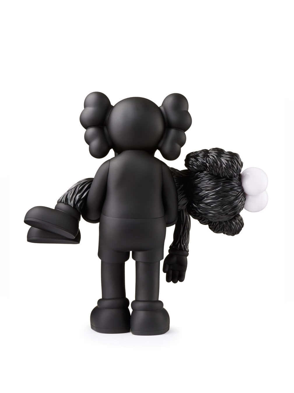 Kaws Bff 桌布 壁紙 — 一個啞光黑色的KAWS人偶從背後觀看，拿著一個帶有白色球體的紋理黑色包裹，背景是純白色。