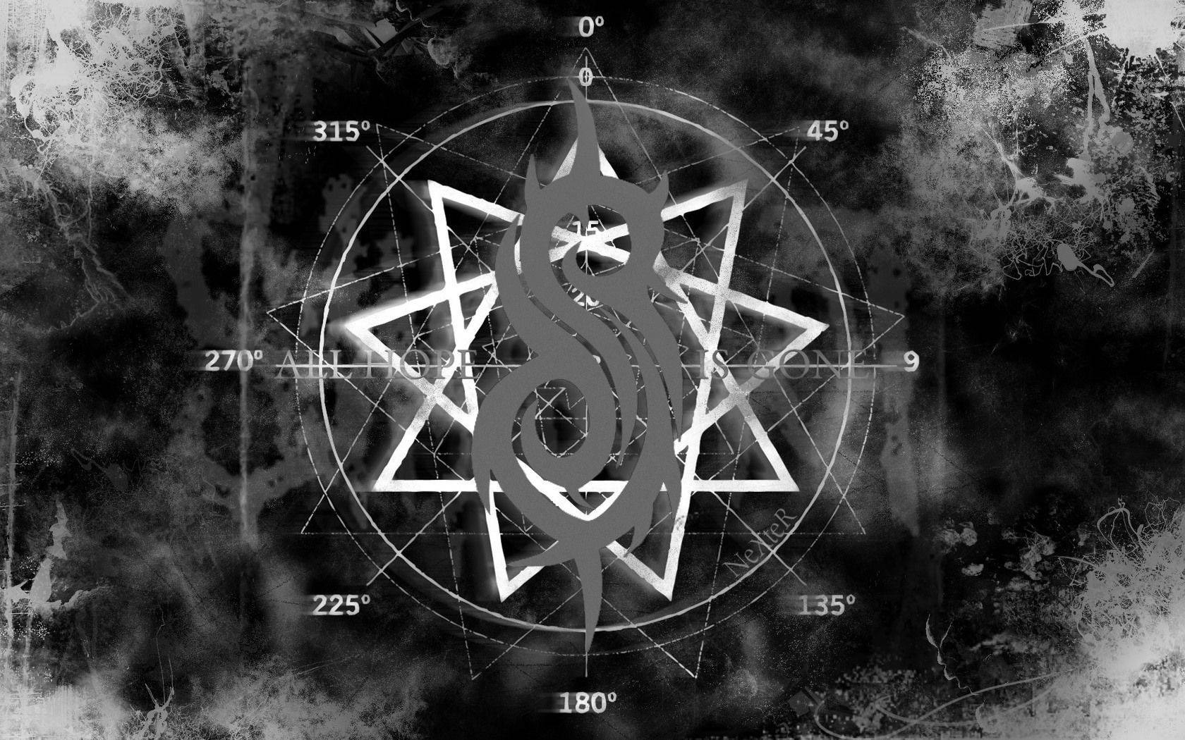 Slipknot 桌布 壁紙 — 一個單色神秘符號，包含一條盤繞的蛇和幾何星形，背景為粗糙紋理。
