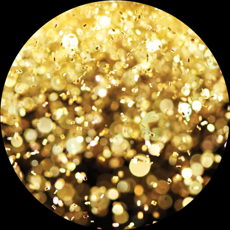 Gold Sparkles 桌布 壁紙 — 一個圓形框架，充滿閃爍的金色閃粉顆粒和散景光，背景為黑色。