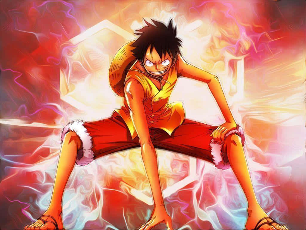 海賊王 桌布 壁紙 — 一個堅定的動漫男孩，穿著橙色背心和紅色短褲，在旋轉的火焰能量中蹲下，眼睛發光。
