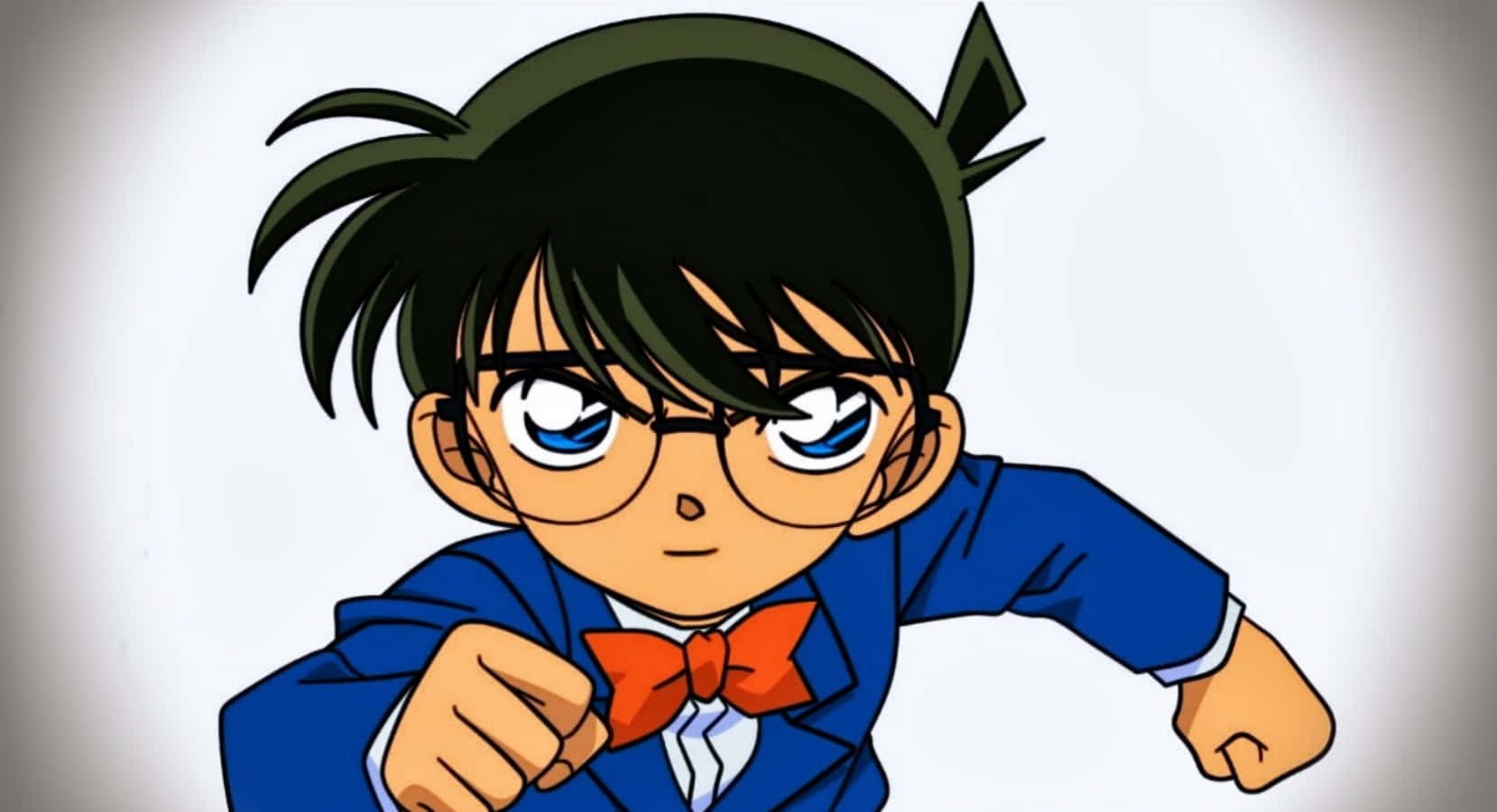 Detective Conan 桌布 壁紙 — 一個堅定的動漫男孩，黑髮、眼鏡、紅色領結，身穿藍色西裝向前指。