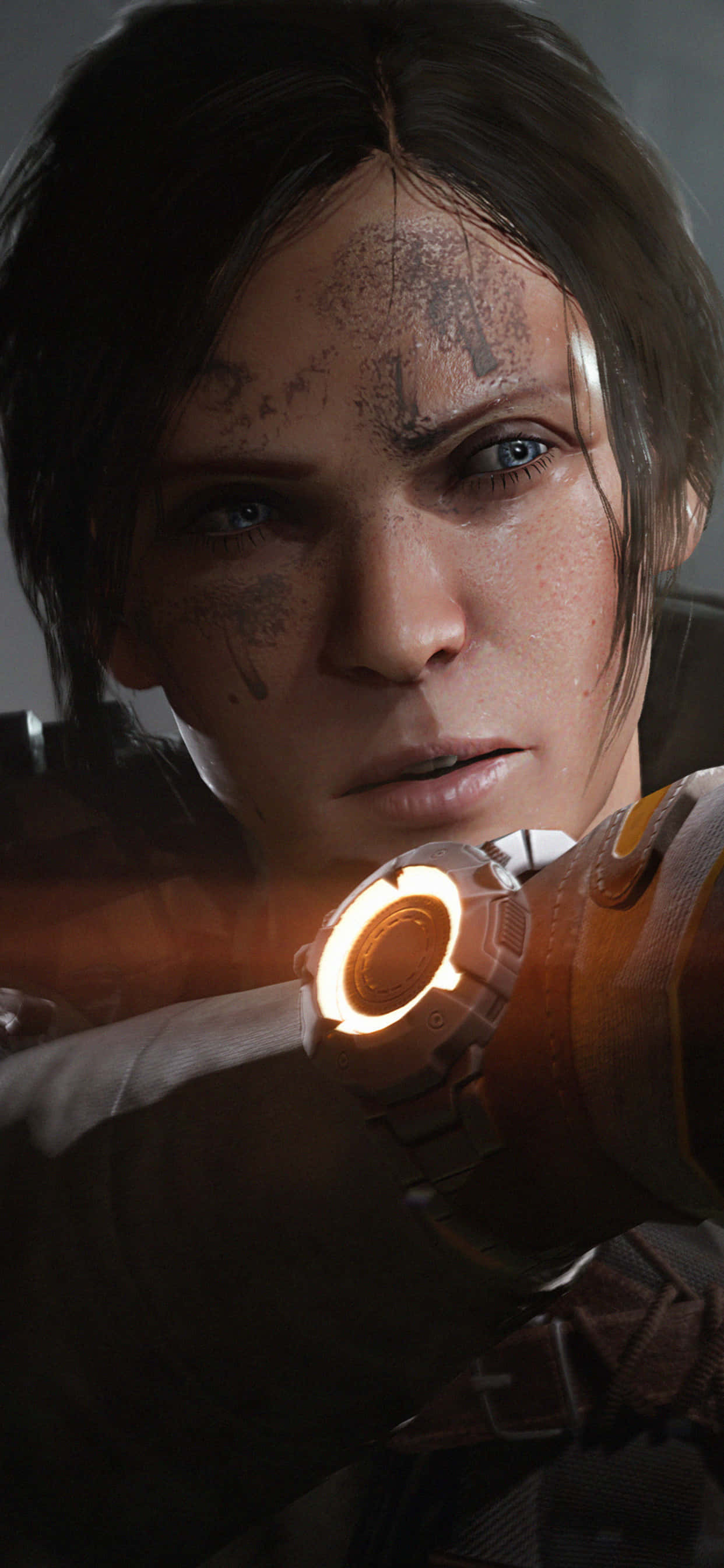 iPhone Xs Max The Division 桌布 壁紙 — 一個堅定的女戰士，臉上沾滿污垢，瞄準發光的橙色武器，粗糙的特寫鏡頭。