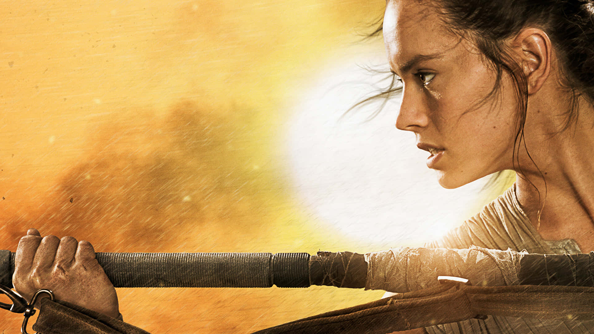 Rey Star Wars 桌布 壁紙 — 一個堅定的女戰士在熾熱的金色背景下，專注地握著一根法杖。