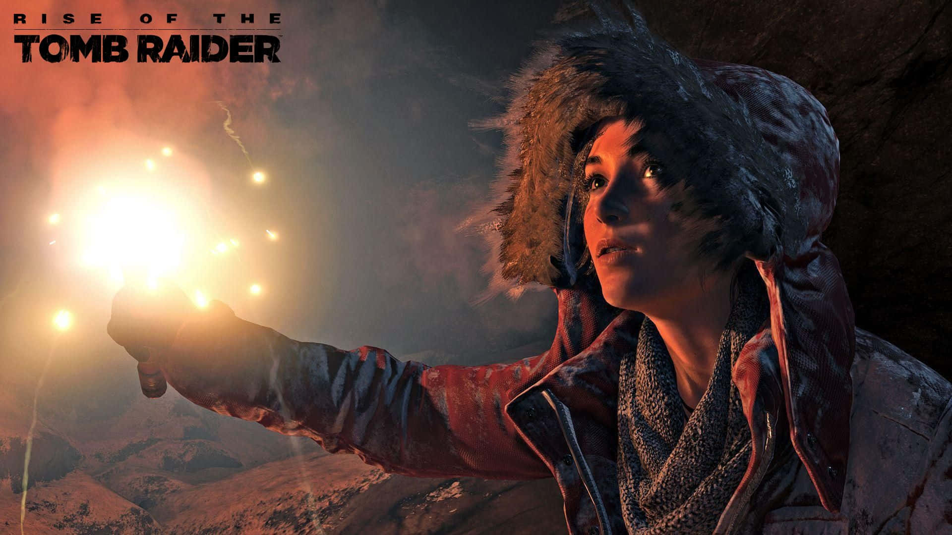Lara Croft 桌布 壁紙 — 一個堅定的蘿拉·卡芙特穿著毛皮襯裡連帽外套，在黑暗的雪山背景下拿著發光的信號火炬。