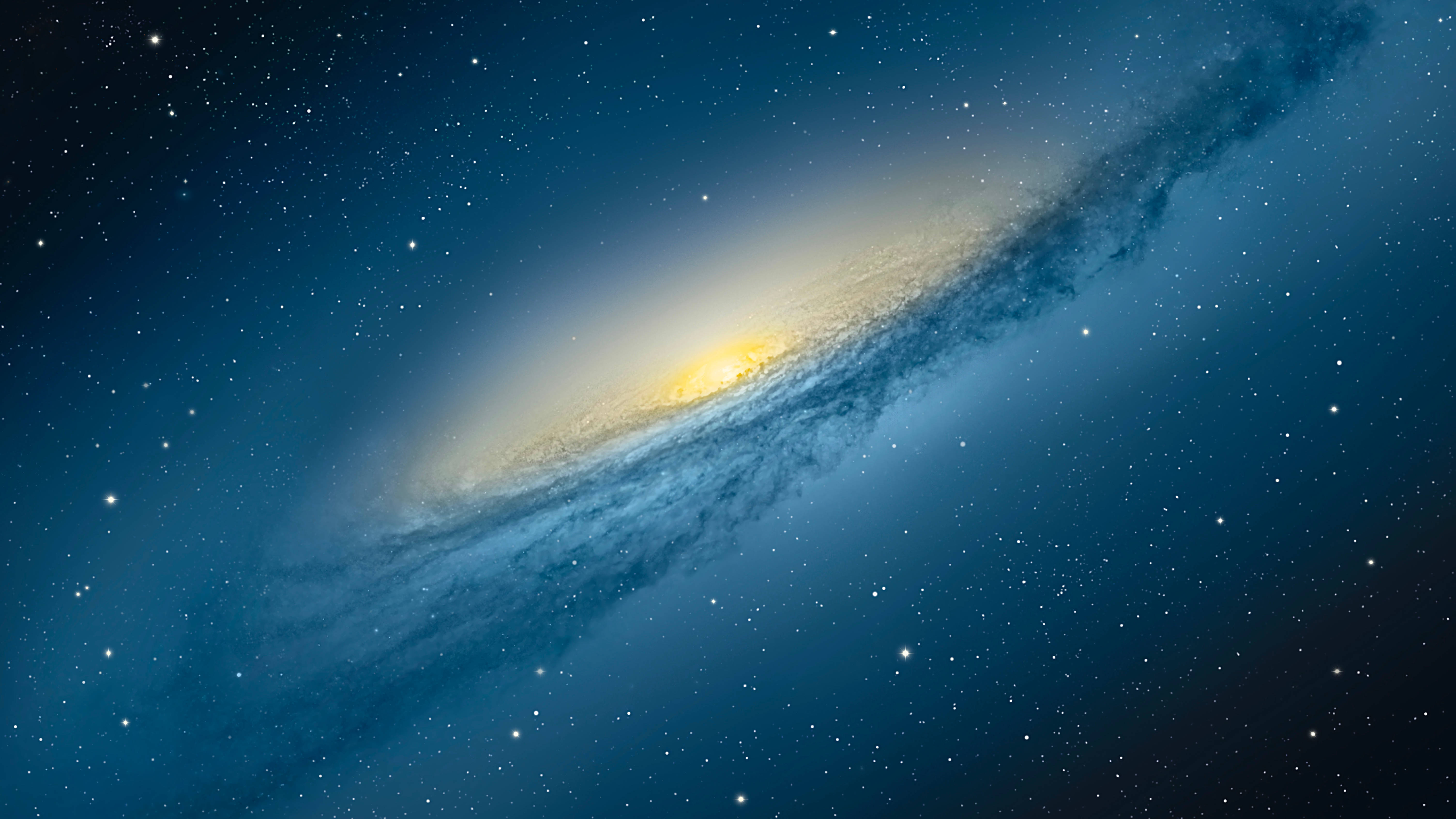 Pretty Galaxy 桌布 壁紙 — 一個壯觀的螺旋星系，金色核心和旋轉的藍色旋臂在星場中閃耀。
