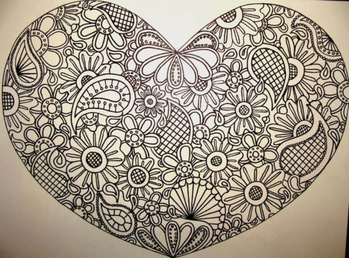 Heart Doodle 桌布 壁紙 — 一個大型精細的心形，充滿了詳細的花卉和佩斯利圖案，以黑色墨水繪製在白色紙上。