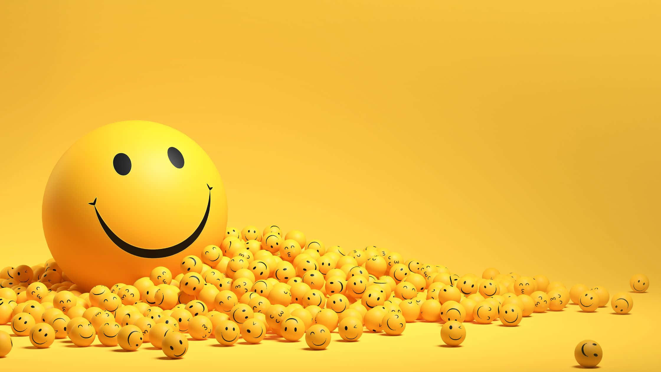 Smile 桌布 壁紙 — 一個大型黃色笑臉球穿過一串較小的笑臉球，在純黃色背景上滾動。