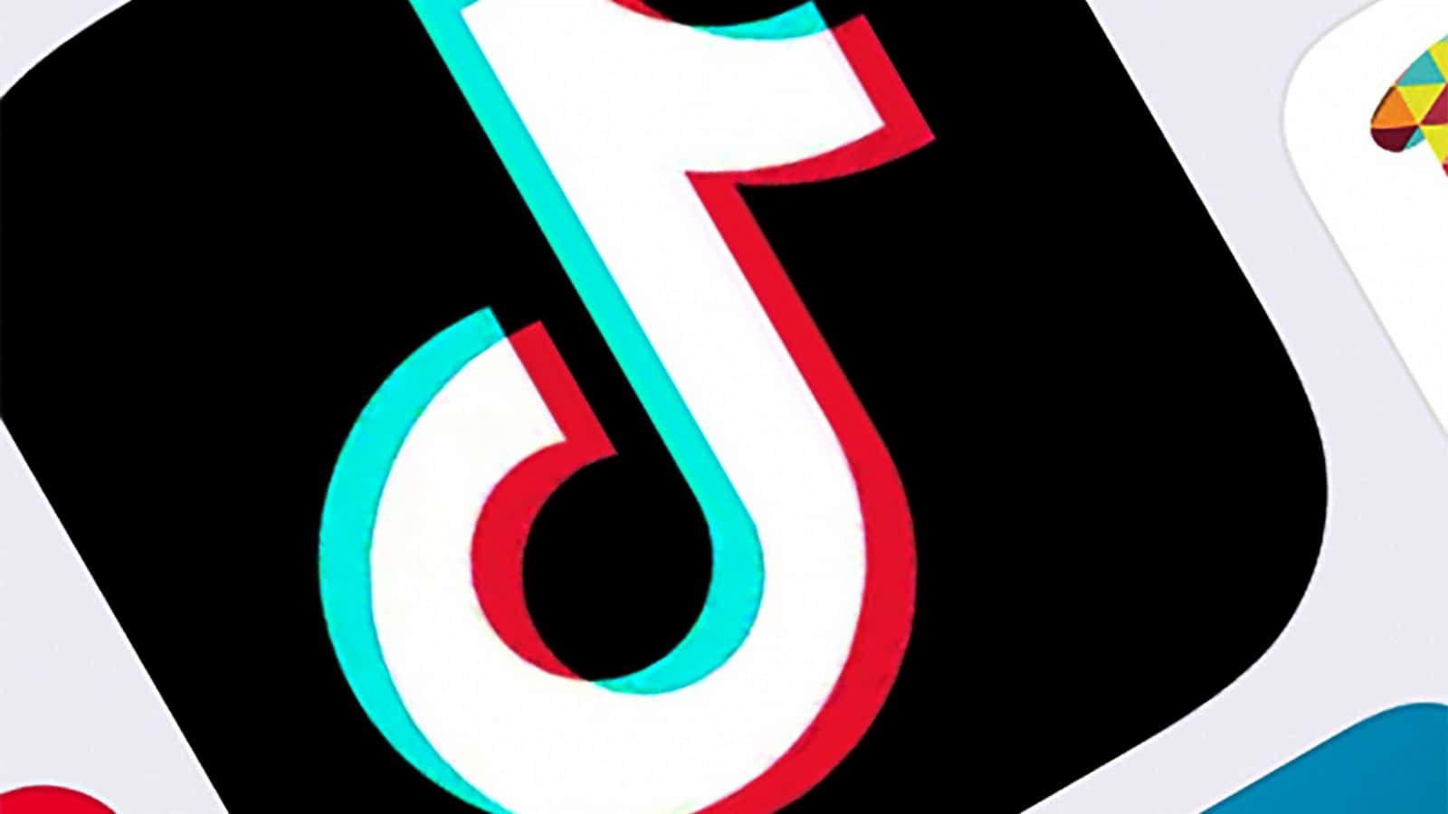 TikTok Symbol 桌布 壁紙 — 一個大膽的TikTok標誌，帶有紅色、藍綠色和白色輪廓，黑色背景，周圍是應用程式圖標。
