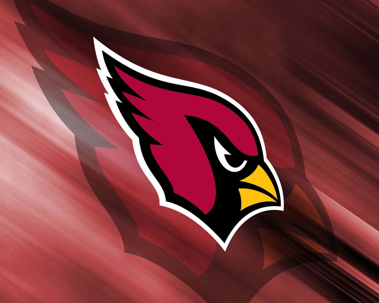 Arizona Cardinals 桌布 壁紙 — 一個大膽的亞利桑那紅雀隊標誌，以紅、黃、黑色的兇猛紅雀頭部，配以動態的紅色運動背景。