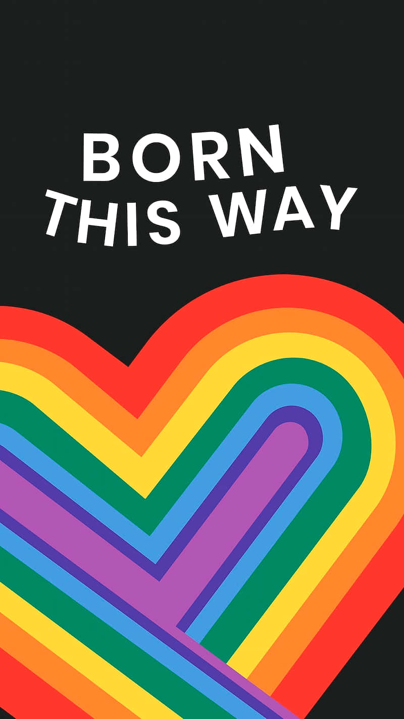 驕傲 桌布 壁紙 — 一個大膽的彩虹心形圖案，上面有「BORN THIS WAY」文字，背景為黑色。
