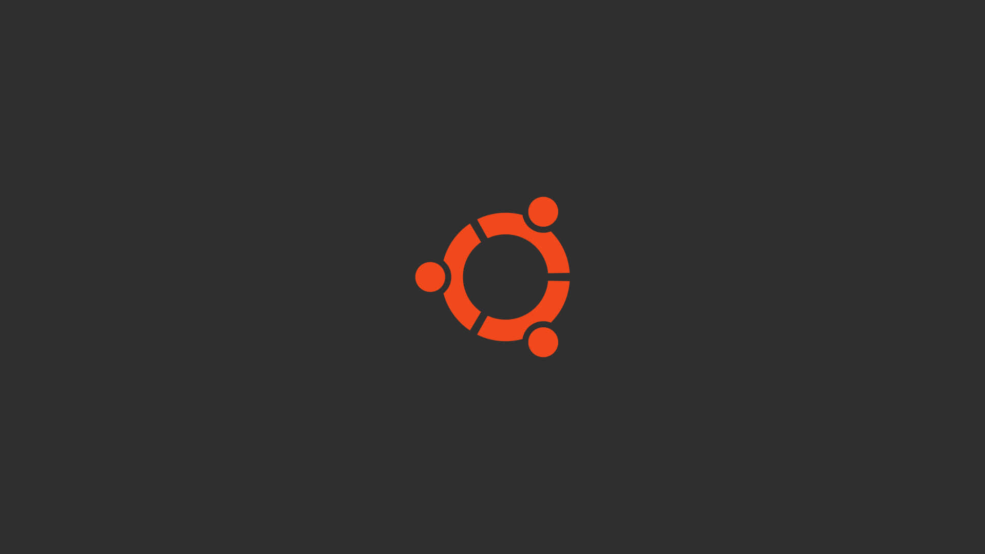 ubuntu 桌布 壁紙 — 一個大膽的橙色 Ubuntu 標誌居中在深灰色背景上，設計簡約。