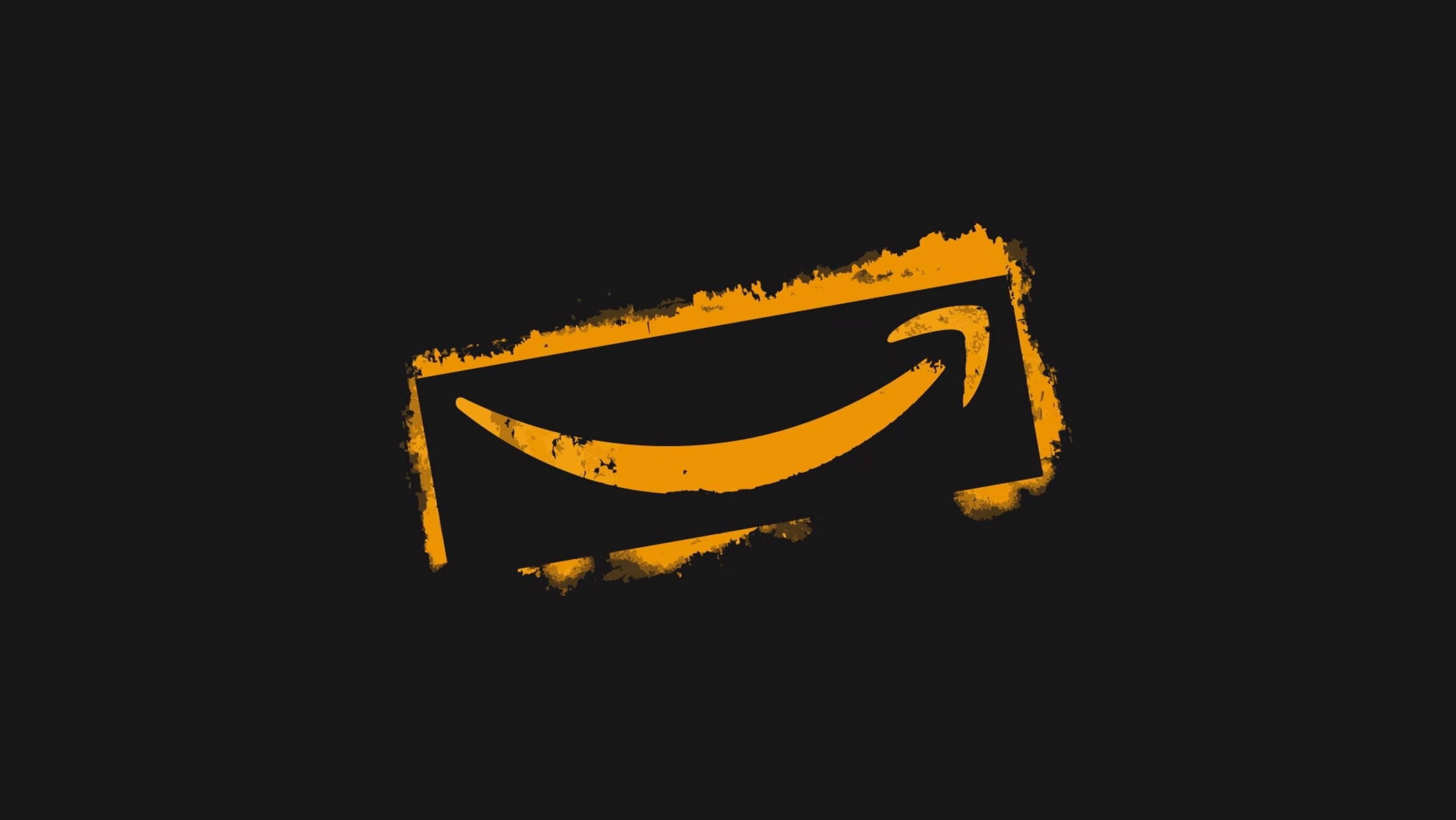 亞馬遜 桌布 壁紙 — 一個大膽的橙色Amazon標誌，帶有磨損紋理，在純黑色背景上脫穎而出。