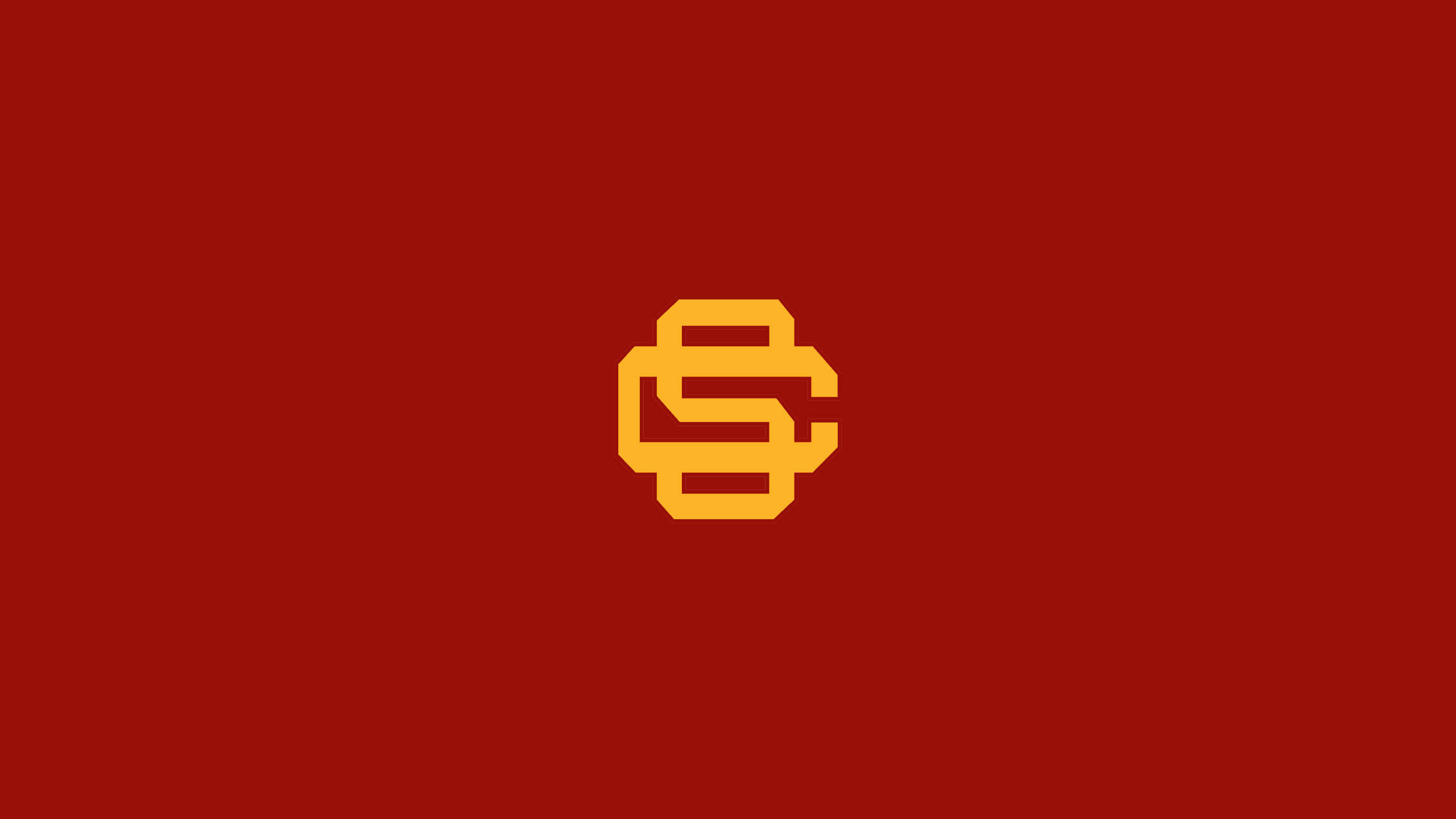 Usc 桌布 壁紙 — 一個大膽的橙色互鎖SC標誌，居中放置在純深紅色背景上。