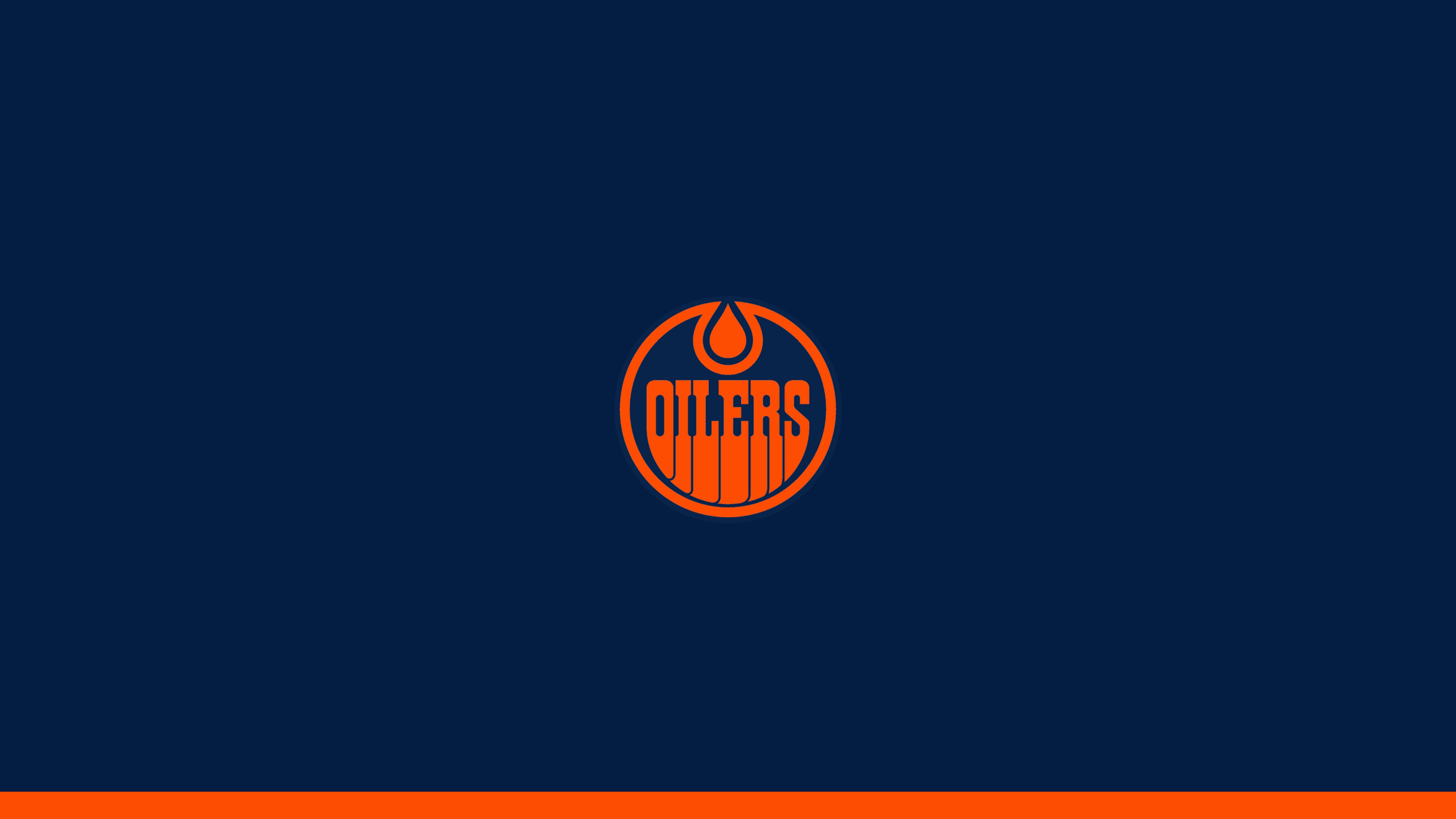Oilers 桌布 壁紙 — 一個大膽的橙色愛德蒙頓油人隊標誌，居中於海軍藍背景上，底部有一條橙色條紋。