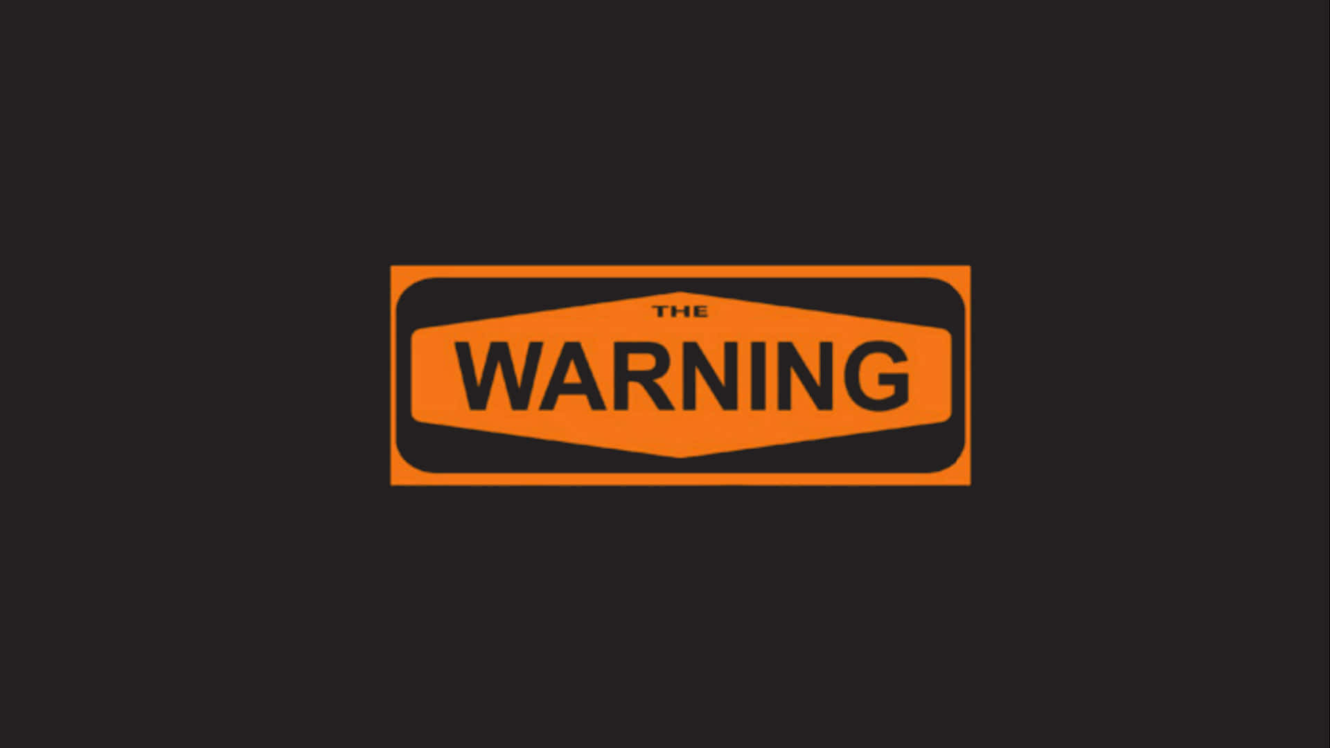 Word 桌布 壁紙 — 一個大膽的橙色警告標誌，黑色文字寫著「THE WARNING」，居中在深灰色背景上。