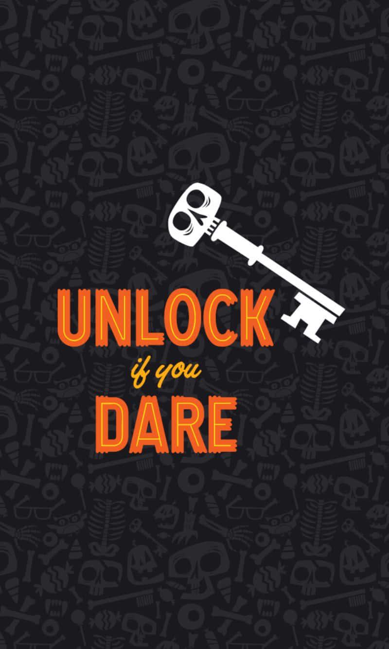 attitude 桌布 壁紙 — 一個大膽的橙色鑰匙圖案，帶有骷髏眼睛，文字 unlock if you dare，背景是深色骷髏和骨頭圖案。