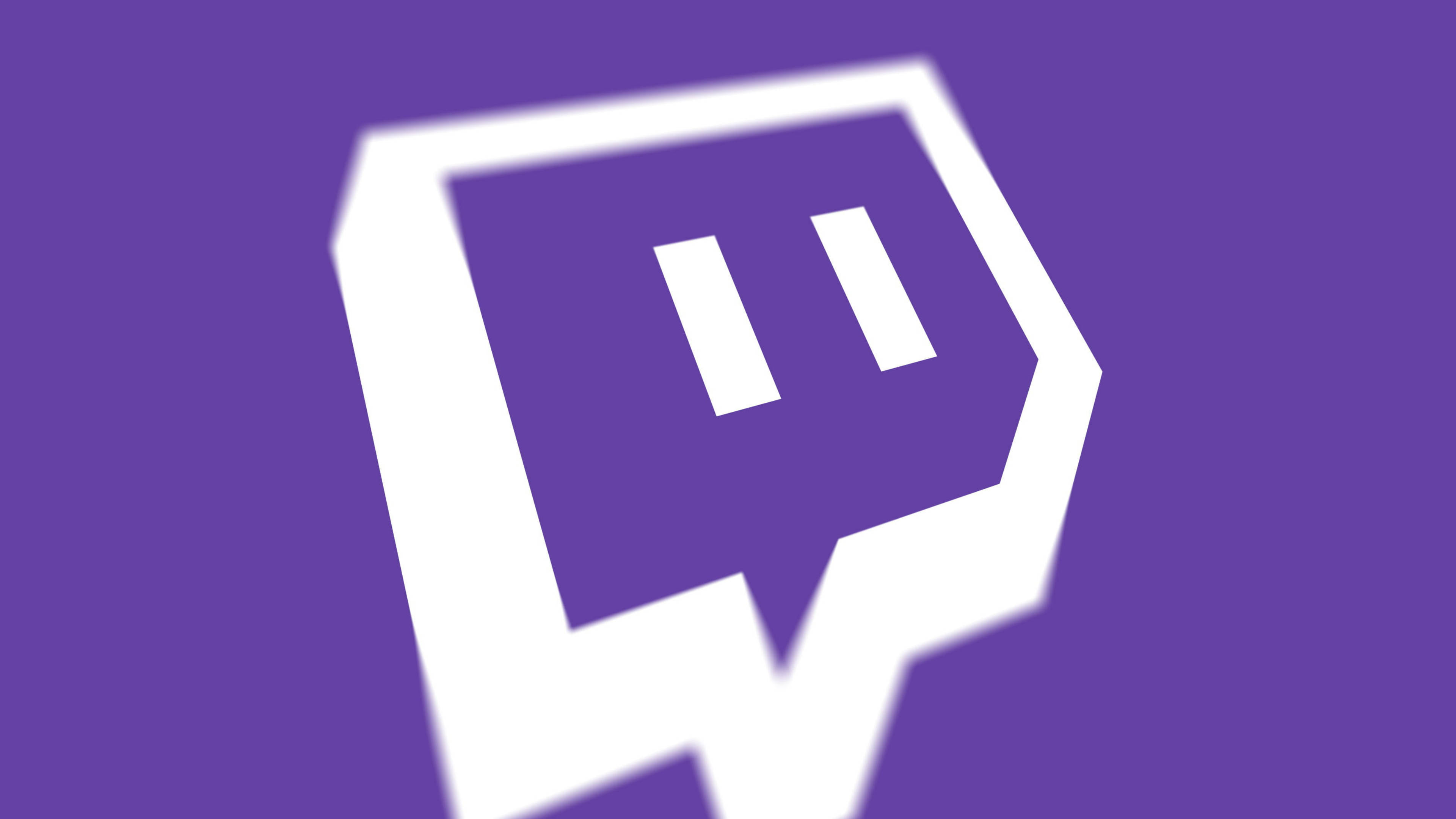 Twitch 桌布 壁紙 — 一個大膽的白色 Twitch 標誌居中在純紫色背景上，帶有柔和漸變模糊效果。