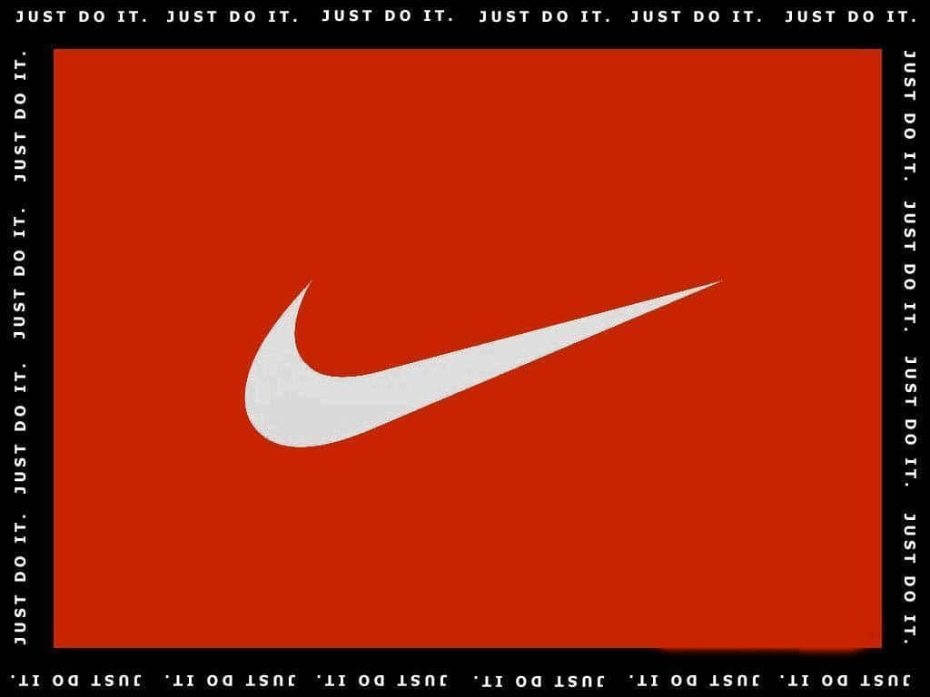 Red Nike 桌布 壁紙 — 一個大膽的白色Nike swoosh標誌，居中於鮮豔的紅色背景上，帶有重複的黑色「JUST DO IT」文字邊框。