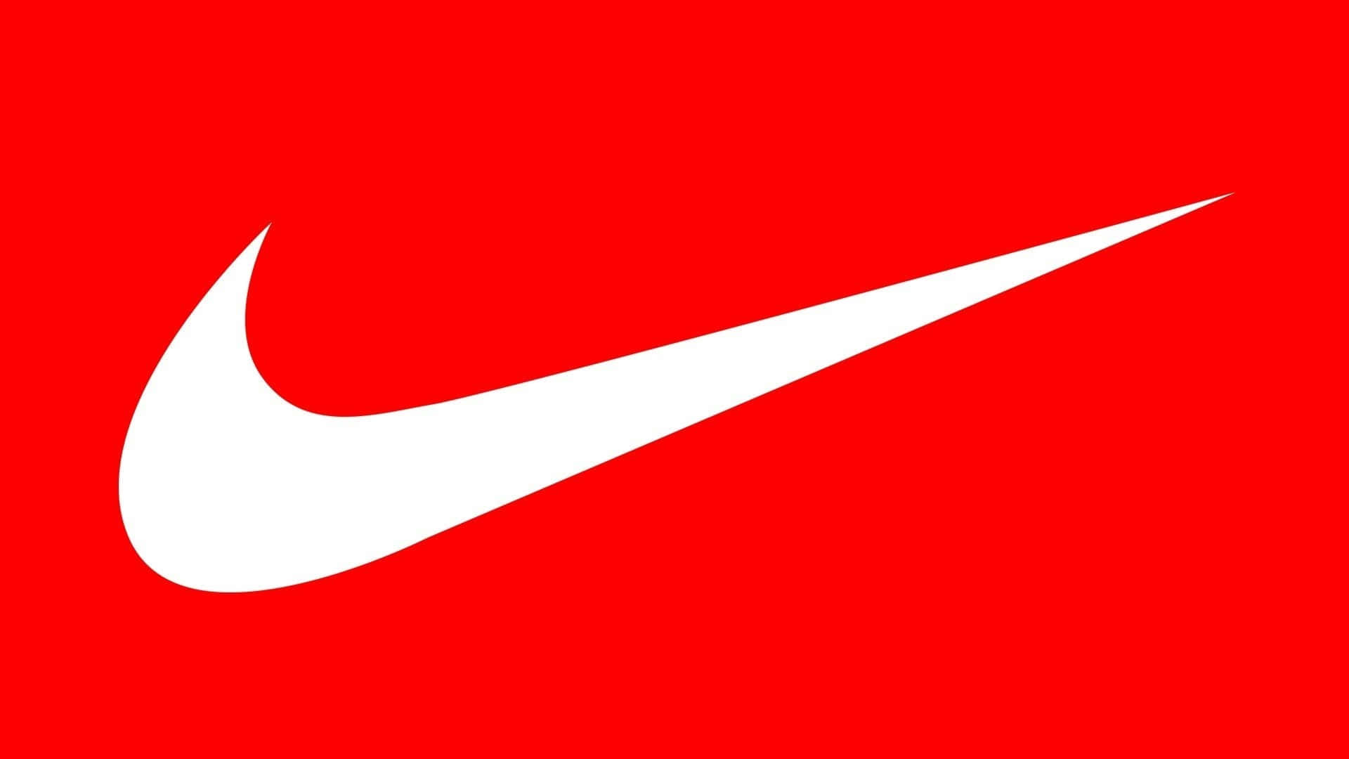 Nike Logo 桌布 壁紙 — 一個大膽的白色Nike Swoosh標誌，居中在充滿活力的純紅色背景上。