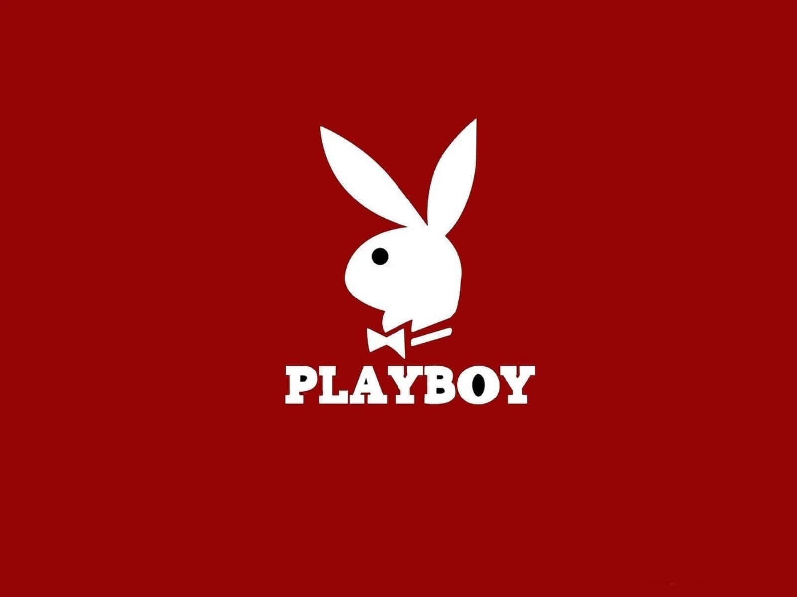 花花公子 桌布 壁紙 — 一個大膽的白色Playboy兔子標誌，帶有蝴蝶結，居中在純紅色背景上。
