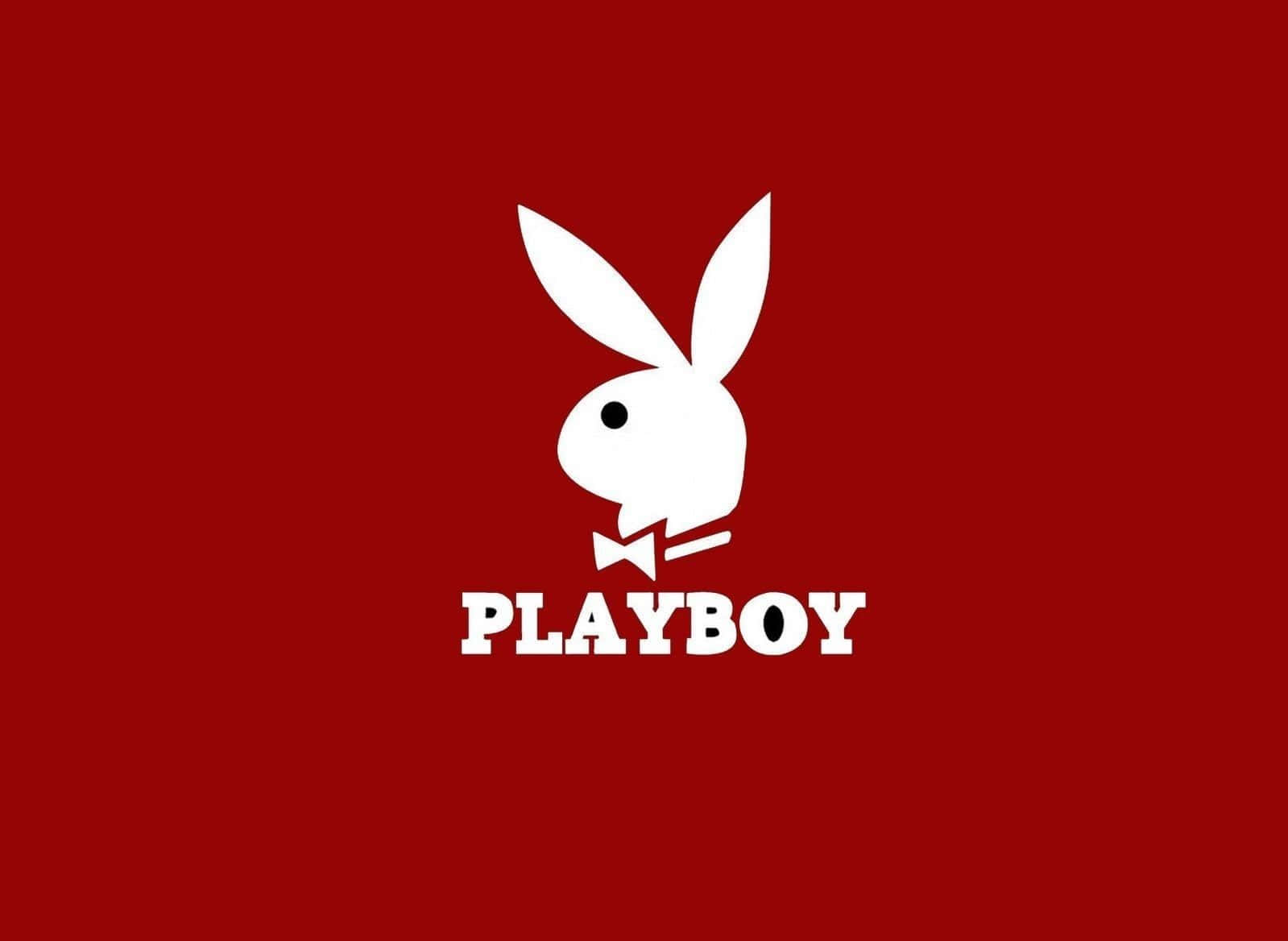 Playboy Aesthetic 桌布 壁紙 — 一個大膽的白色Playboy兔子標誌，帶有蝴蝶結，居中在純紅色背景上。