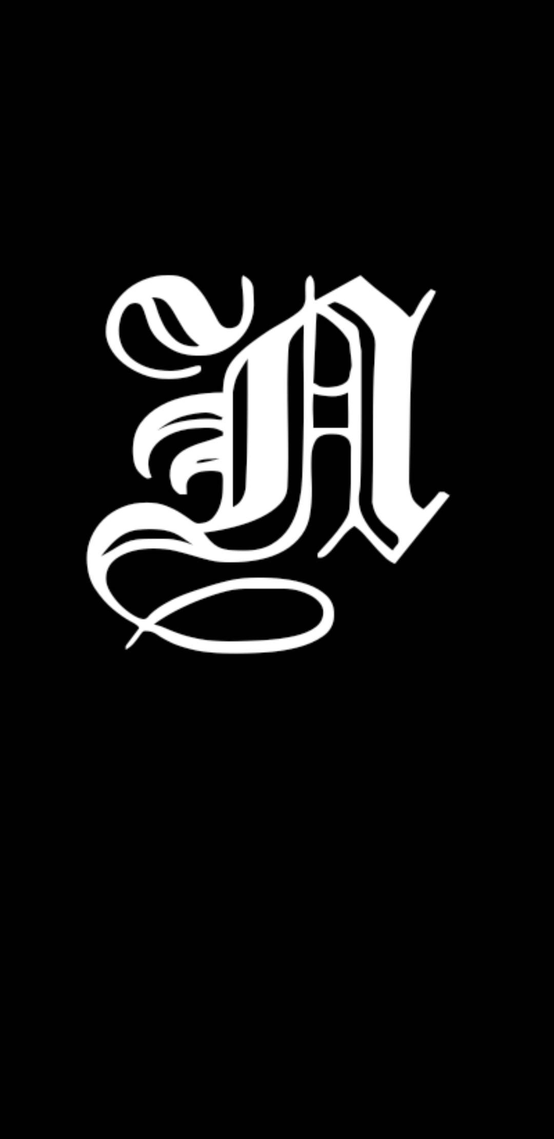 Black And White Graffiti 桌布 壁紙 — 一個大膽的白色華麗字母A居中於純黑色背景上。