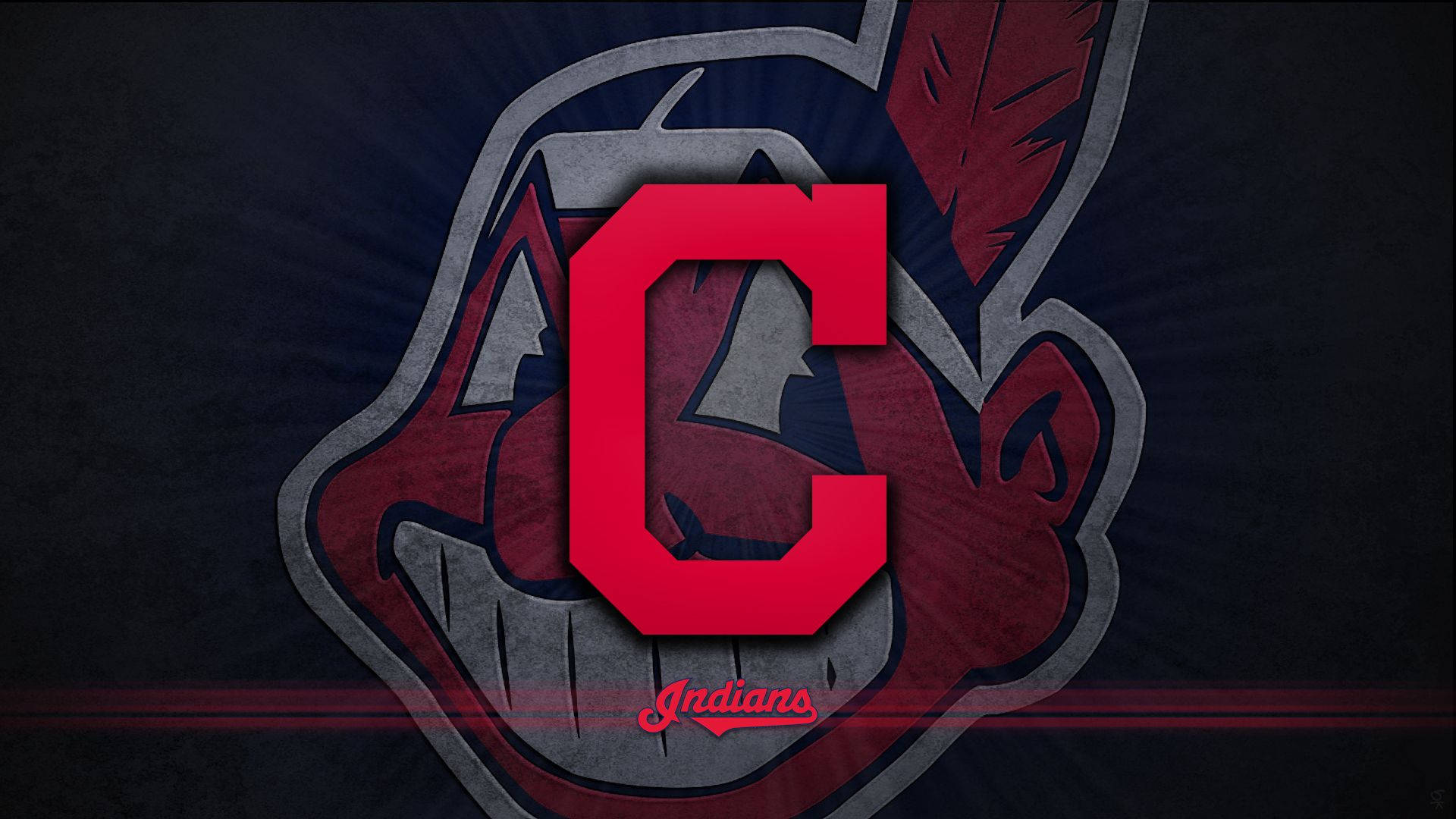 Cleveland Indians 桌布 壁紙 — 一個大膽的紅色 'C' 標誌，居中在一個風格化的美洲原住民吉祥物頭像上，帶有羽毛和牙齒細節，背景為深色紋理。