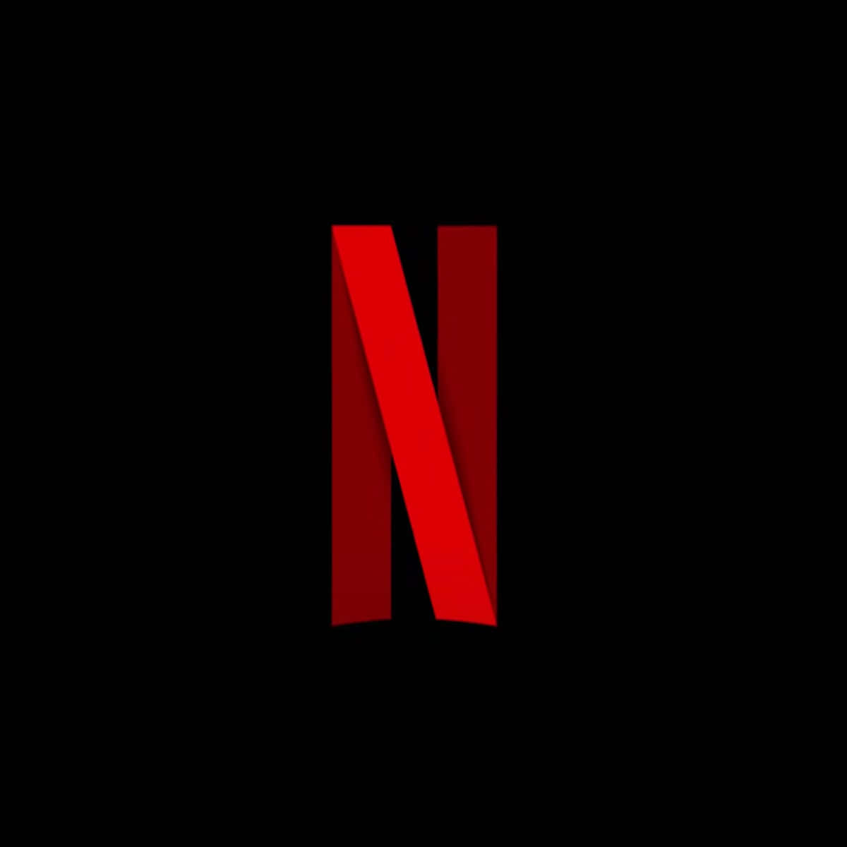 Netflix 桌布 壁紙 — 一個大膽的紅色 Netflix 標誌居中顯示在帶有微妙漸變陰影的純黑色背景上。