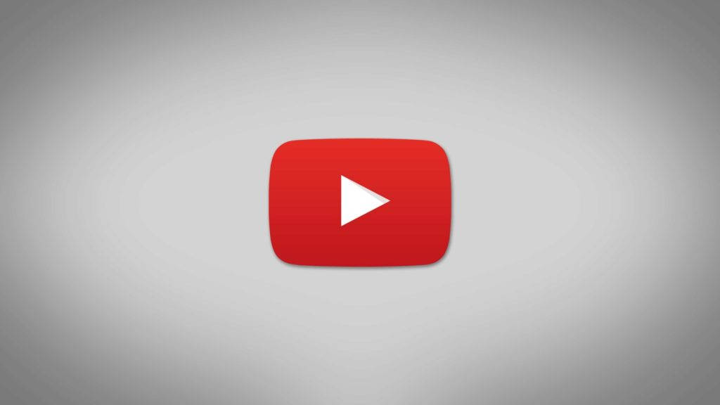 白色 桌布 壁紙 — 一個大膽的紅色 YouTube 播放按鈕圖示，居中於柔和的灰色漸變背景上。