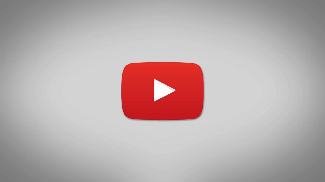 美學 桌布 壁紙 — 一個大膽的紅色 YouTube 播放按鈕圖示，居中於柔和的灰色漸變背景上。