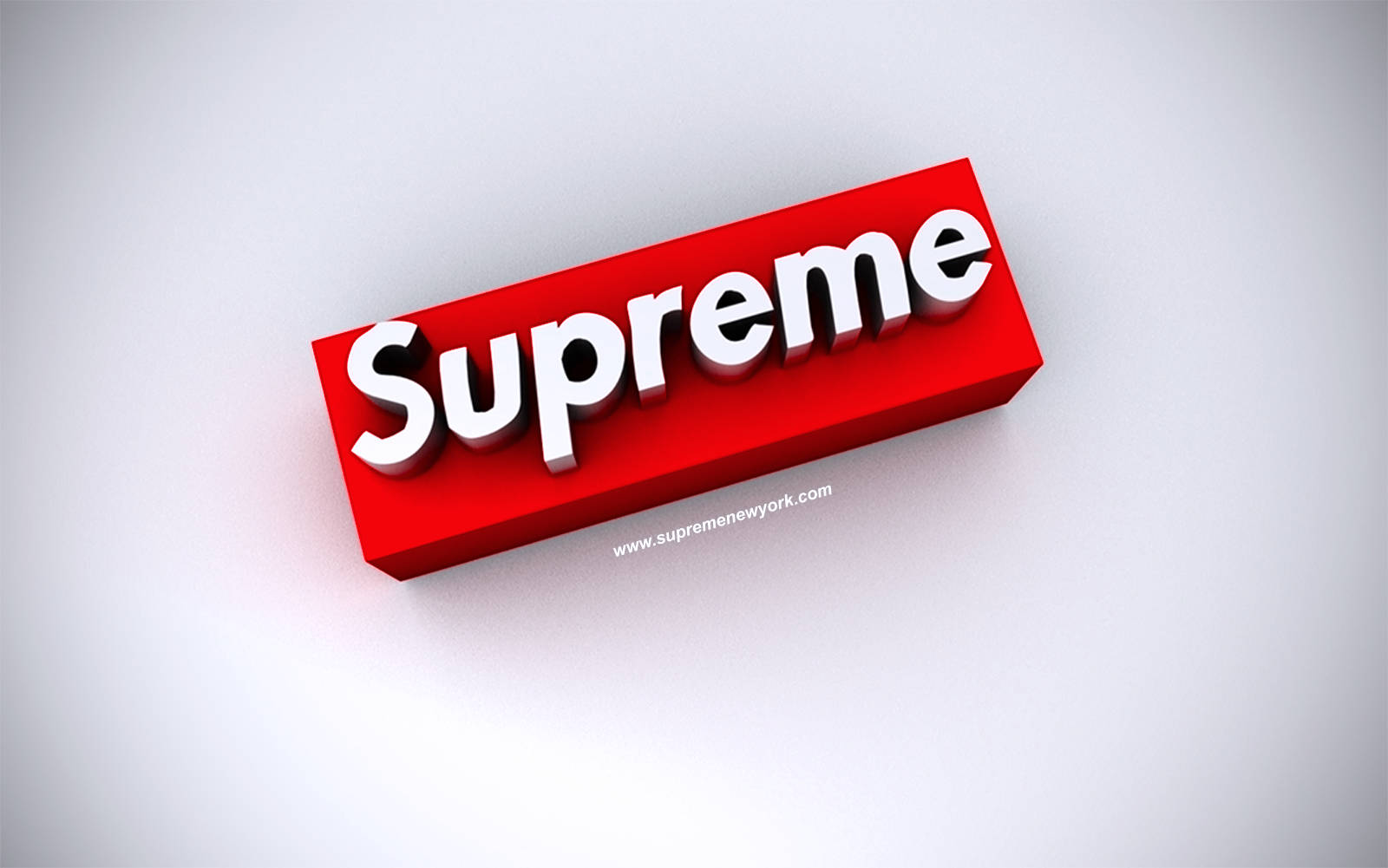 3D 桌布 壁紙 — 一個大膽的紅色Supreme標誌盒子，帶有白色3D字體，放置在潔白的表面上，投射出柔和陰影。