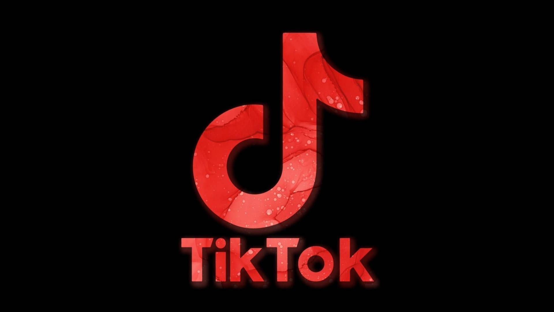 TikTok 動圖 桌布 壁紙 — 一個大膽的紅色TikTok標誌，帶有大理石紋理和發光邊緣，在純黑色背景上脫穎而出。