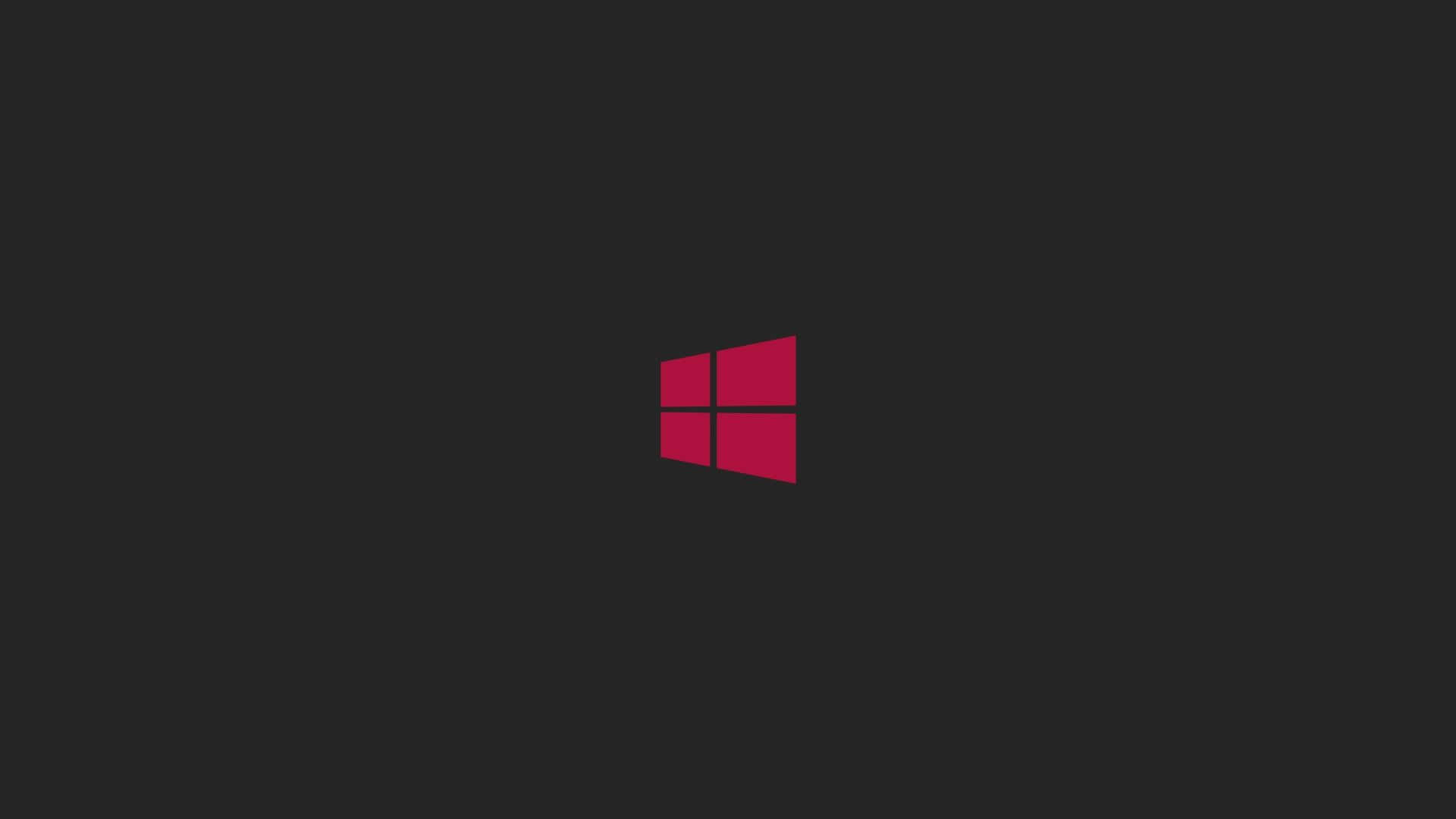 Black Windows 桌布 壁紙 — 一個大膽的紅色Windows標誌居中在純深灰色背景上。